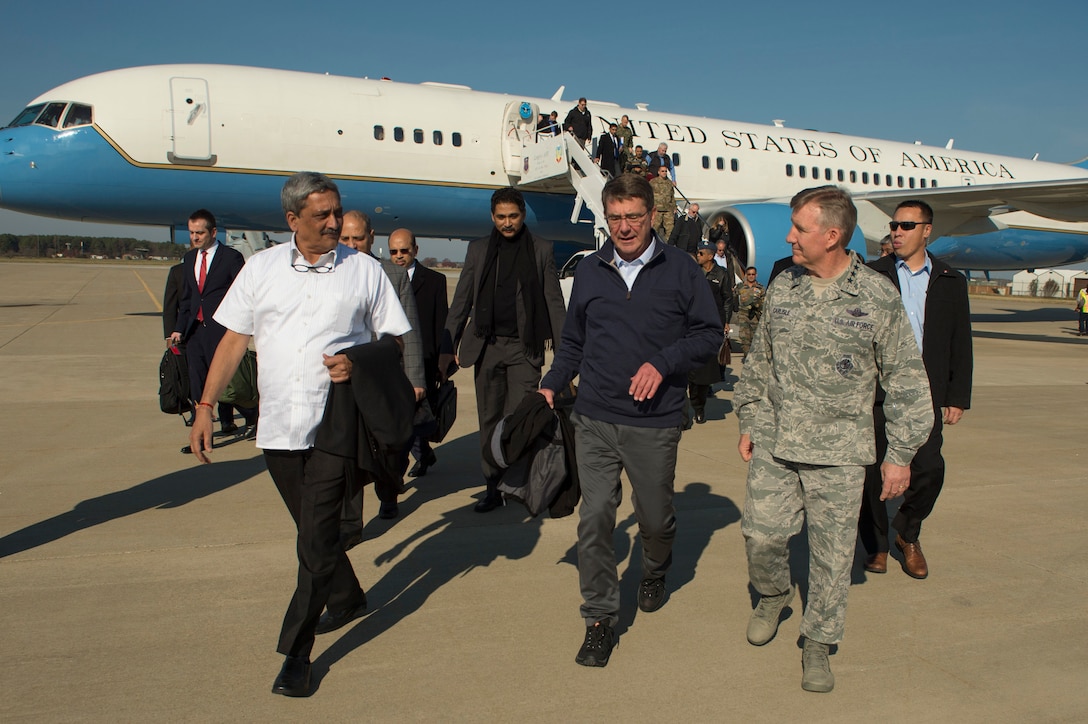 U.S. Defense Secretary Ash Carter, center, and Indian Defense Minister Manohar Parrikar, left, walk with U.S. Air Force Gen. Herbert J. "Hawk" Carlisle, commander of Air Combat Command, on arrival at Langley Air Force Base, Va., before boarding an MV-22 Osprey to tour the USS Dwight D. Eisenhower in the Atlantic Ocean Dec. 10, 2015. DoD photo by Senior Master Sgt. Adrian Cadiz