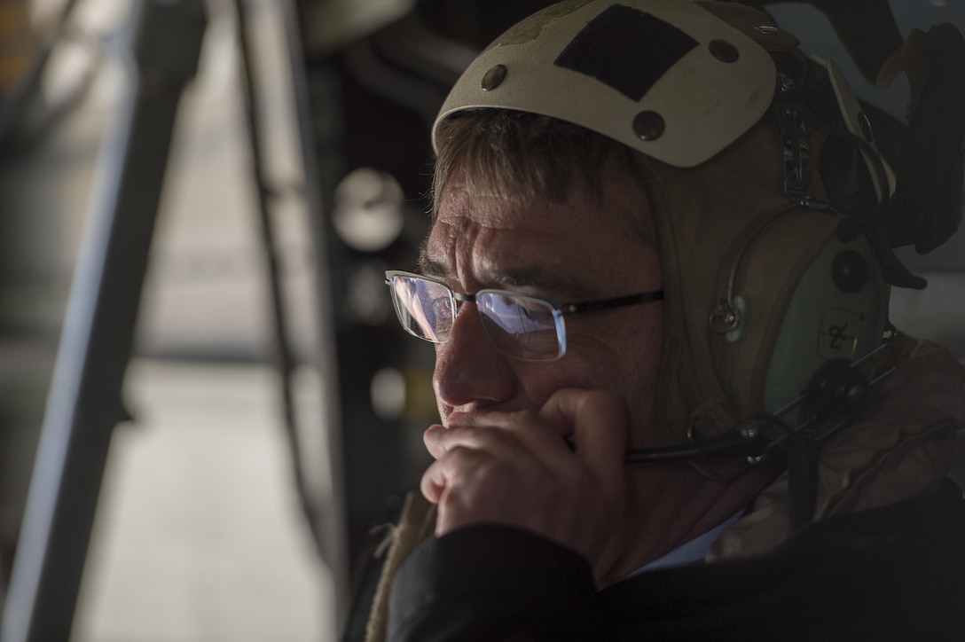 U.S. Defense Secretary Ash Carter communicates with the aircrew members on an MV-22 Osprey, while in transit to the USS Dwight D. Eisenhower with Indian Defense Minister Manohar Parrikar to tour the aircraft carrier in the Atlantic Ocean, Dec. 10, 2015. DoD photo by Air Force Senior Master Sgt. Adrian Cadiz