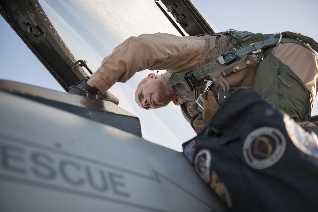 U.S. Air Force Col. Henry Rogers, 455th Expeditionary Operations Group commander, climbs into an F-16 Fighting Falcon prior to a sortie with the 421st Expeditionary Fighter Squadron at Bagram Airfield, Afghanistan, Nov. 27, 2015. Rogers recently reached the 3,000-flying hour milestone and 1,000 combat-hour milestone while serving on his eighth combat deployment. U.S. Air Force photo by Tech. Sgt. Robert Cloys