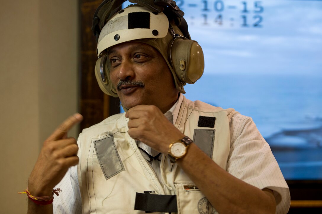 Indian Defense Minister Manohar Parrikar arrives on the USS Dwight D. Eisenhower in the Atlantic Ocean, Dec. 10, 2015. U.S. Defense Secretary Ash Carter and Parrikar toured the aircraft carrier after the two leaders met at the Pentagon to discuss matters of mutual interest. DoD photo by Air Force Senior Master Sgt. Adrian Cadiz