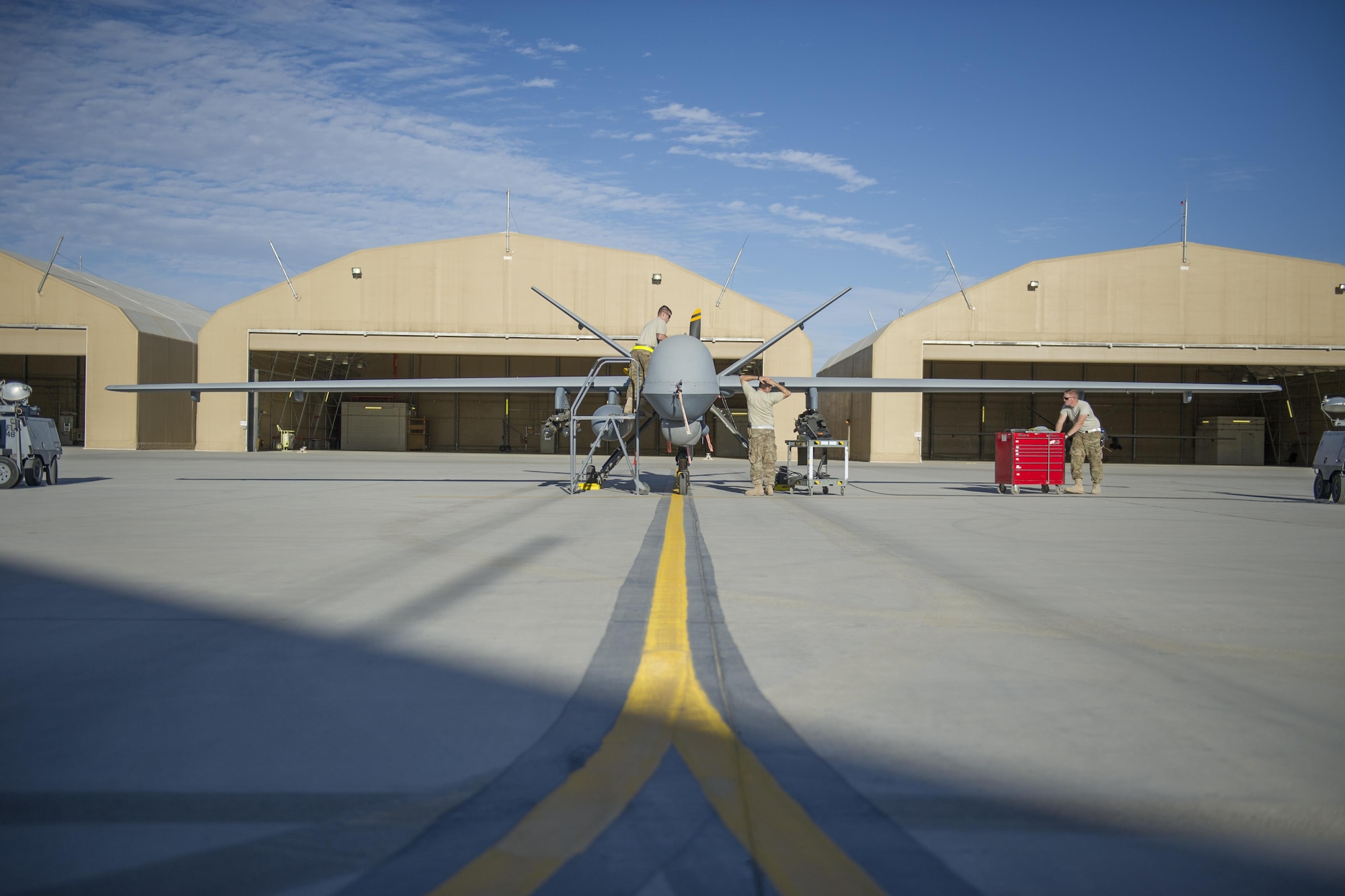 Aircraft specialists from the 62nd Expeditionary Reconnaissance Squadron prepare a MQ-9 Reaper for a sortie at Kandahar Airfield, Afghanistan, Dec. 5, 2015. The Reaper is an armed, multi-mission, medium-altitude, long-endurance remotely piloted aircraft that is employed primarily as an intelligence-collection asset and secondarily against dynamic execution targets. (U.S. Air Force photo by Tech. Sgt. Robert Cloys/Released)