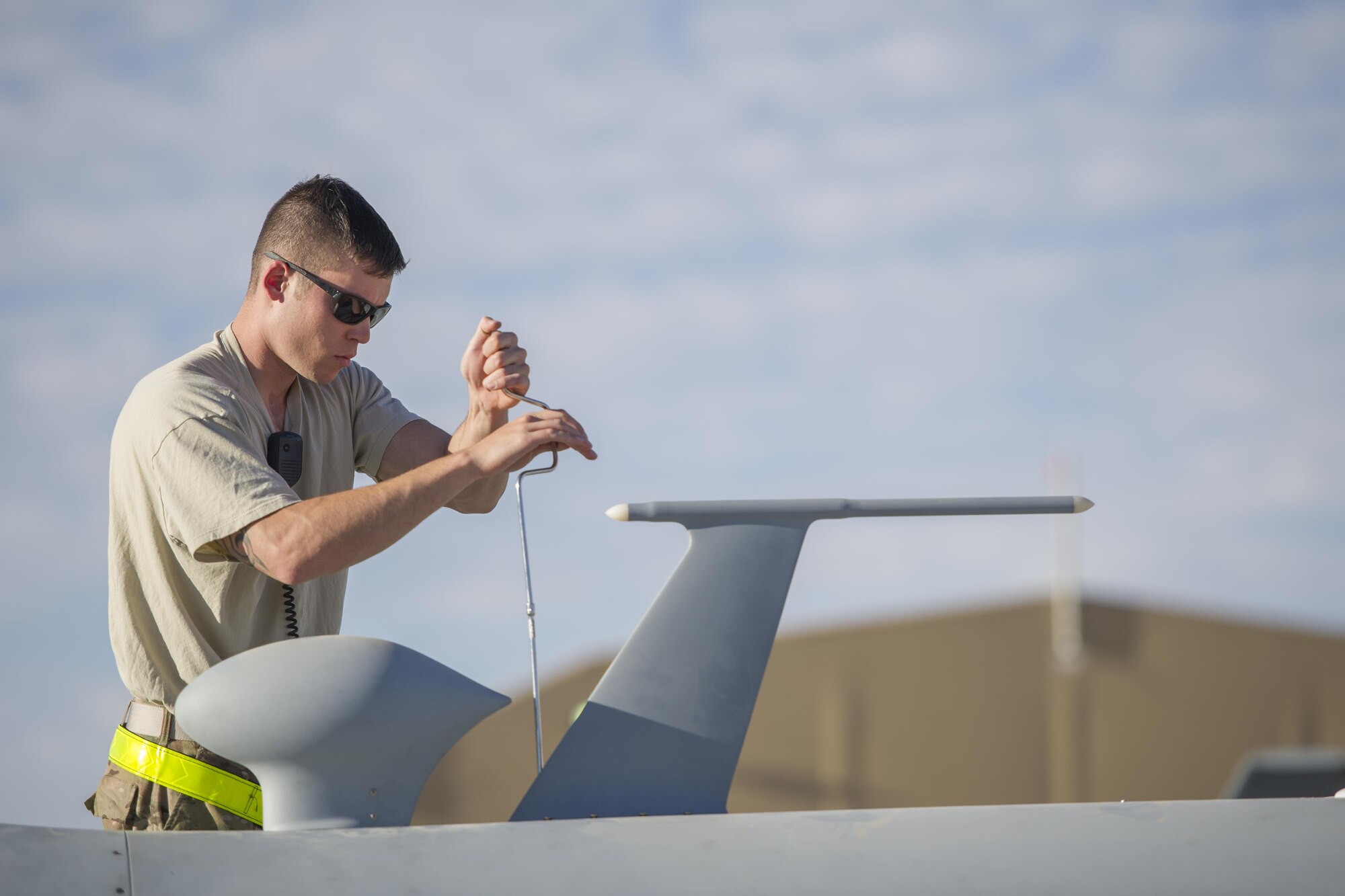 Senior Airman David, 62nd Expeditionary Reconnaissance Squadron aircraft specialist, secures a radio antenna on an MQ-9 Reaper prior to a sortie at Kandahar Airfield, Afghanistan, Dec. 5, 2015. The Reaper is an armed, multi-mission, medium-altitude, long-endurance remotely piloted aircraft that is employed primarily as an intelligence-collection asset and secondarily against dynamic execution targets. (U.S. Air Force photo by Tech. Sgt. Robert Cloys/Released)
