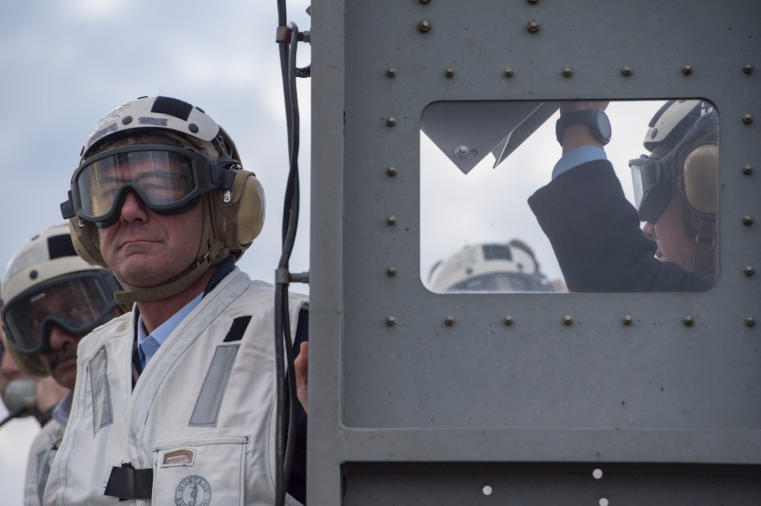 U.S. Defense Secretary Ash Carter, foreground, and Indian Defense Minister Manohar Parrikar observe flight operations during a tour of the USS Dwight D. Eisenhower in the Atlantic Ocean, Dec. 10, 2015. DoD photo by Air Force Senior Master Sgt. Adrian Cadiz