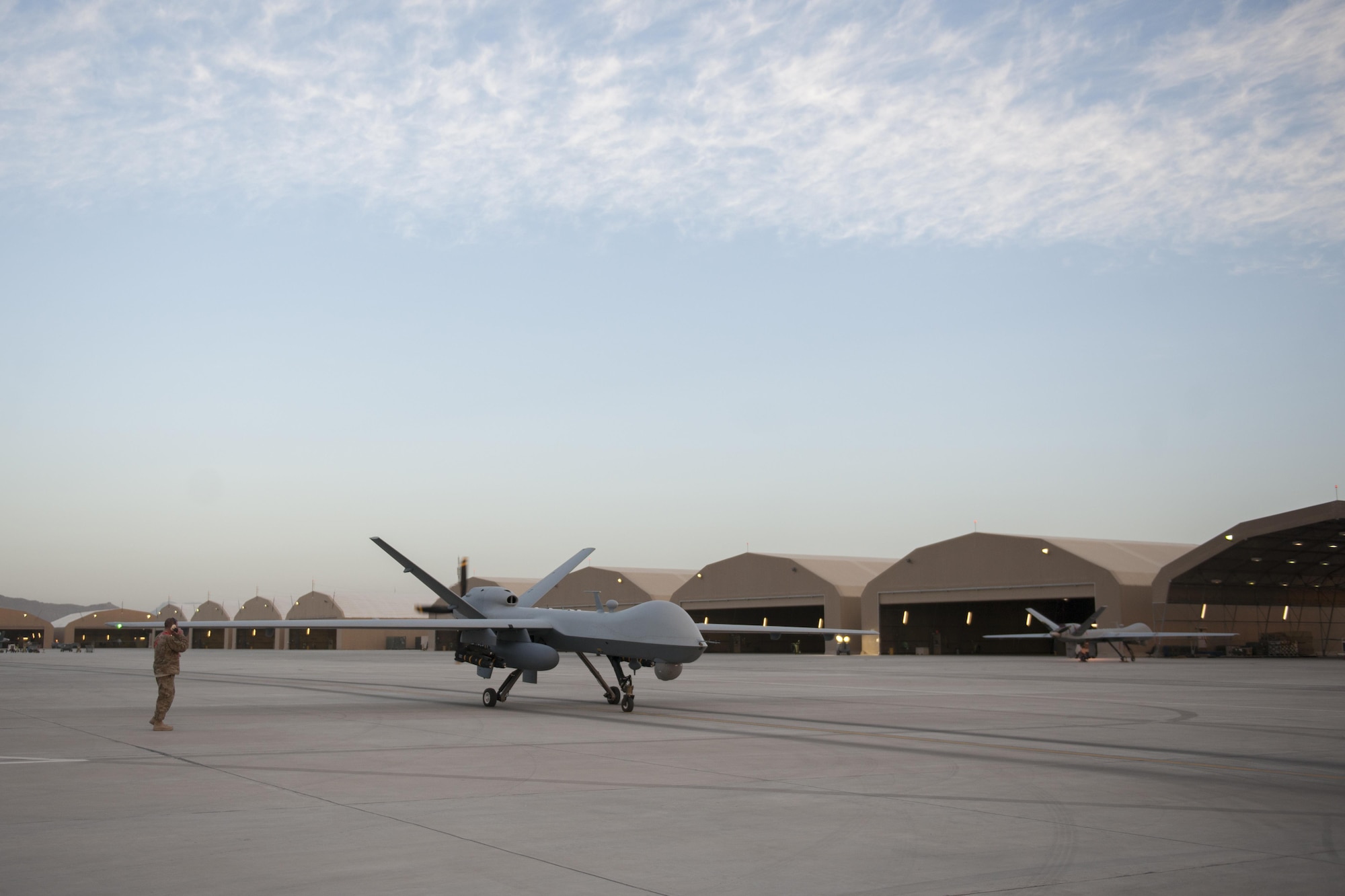 An MQ-9 Reaper equipped with an extended range modification from the 62nd Expeditionary Reconnaissance Squadron stops on the ramp at Kandahar Airfield, Afghanistan, for end of runway checks, Dec. 6, 2015. The Reaper is an armed, multi-mission, medium-altitude, long-endurance remotely piloted aircraft that is employed primarily as an intelligence-collection asset and secondarily against dynamic execution targets. (U.S. Air Force photo by Tech. Sgt. Robert Cloys/Released)