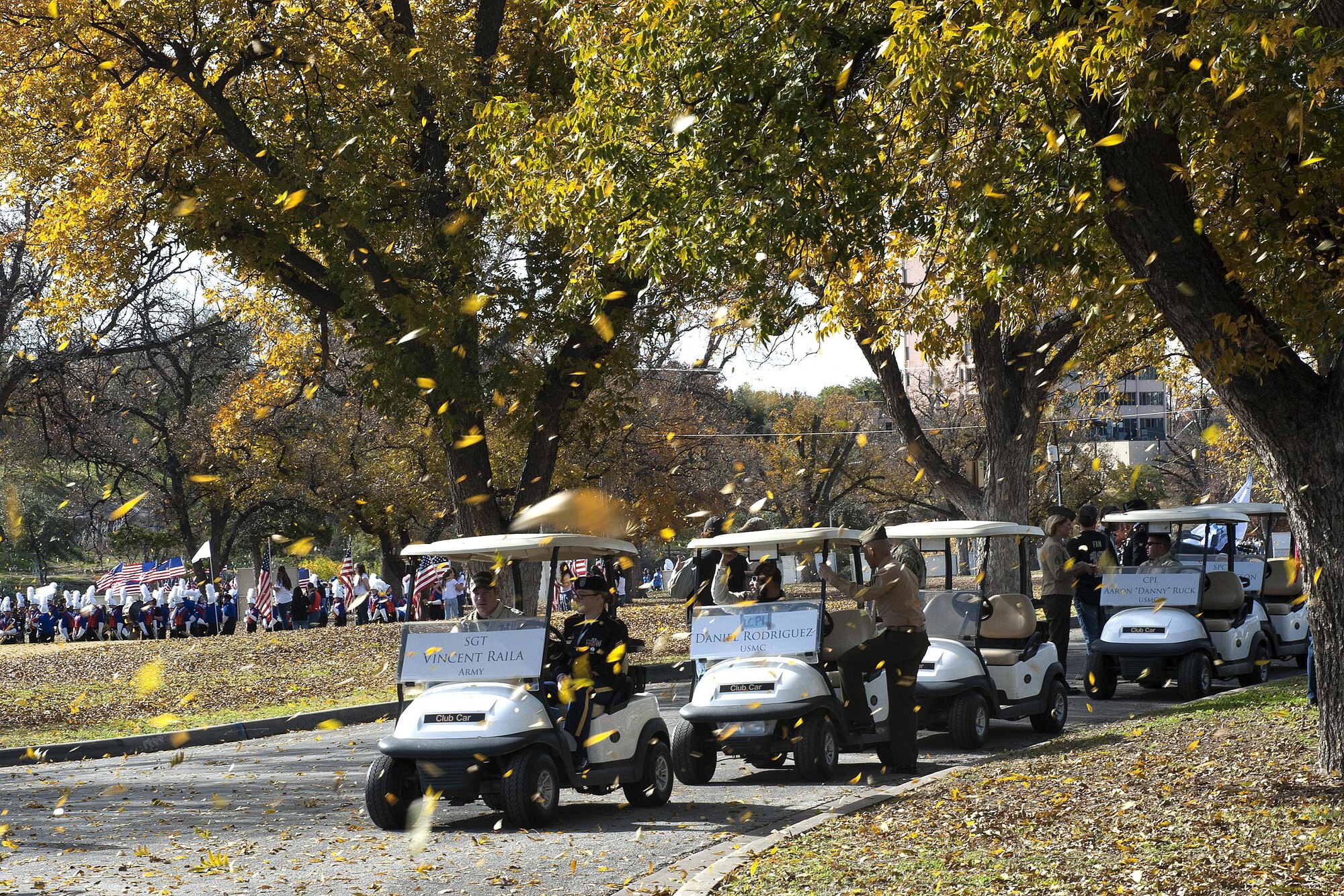 Wounded Warriors line up with their escorts in golf carts to the sound of local school bands during the Heroes Parade in Sante Fe Park, San Angelo, Texas, Dec. 10, 2015. The parade was held to honor wounded warriors and provide them an opportunity to connect with the community. (U.S. Air Force photo by Airman 1st Class Caelynn Ferguson/Released)

