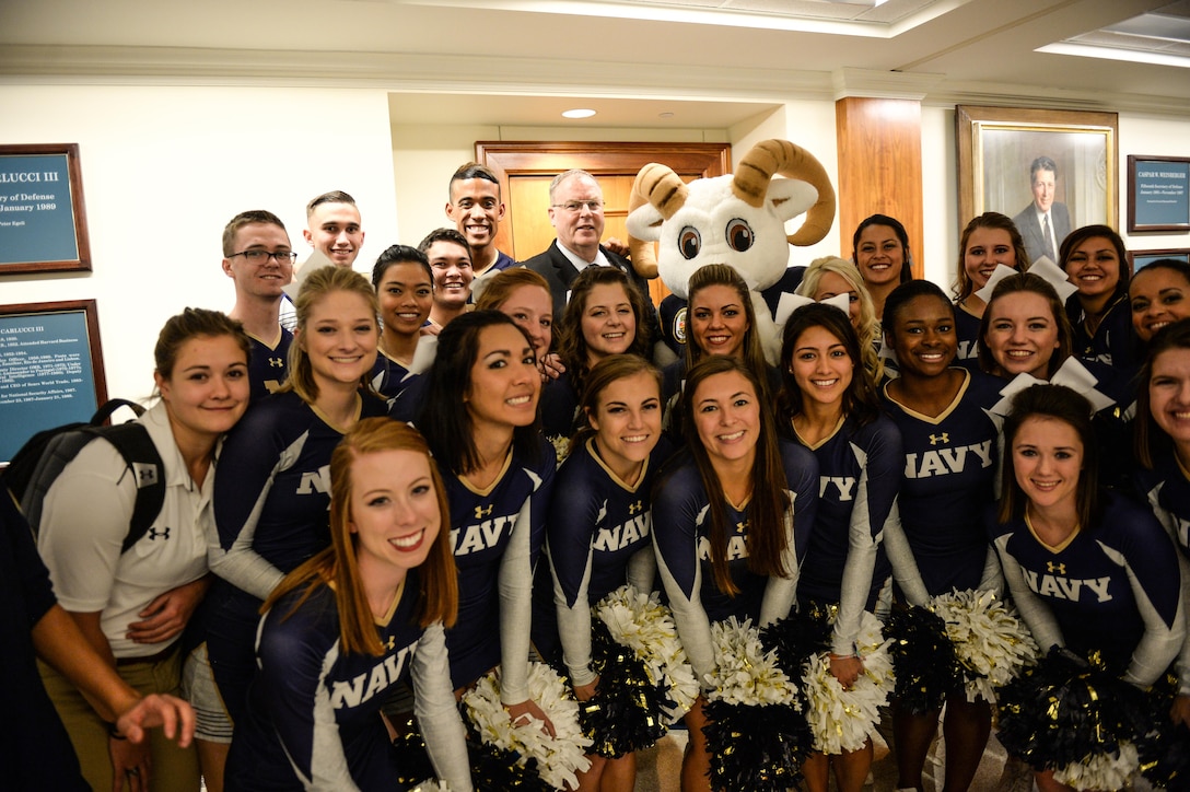 Deputy Defense Secretary Bob Work, center back, poses for a photograph with Navy supporters during a pep rally at the Pentagon, Dec. 10, 2015, before the upcoming Army-Navy game. DoD photo by Army Sgt. 1st Class Clydell Kinchen