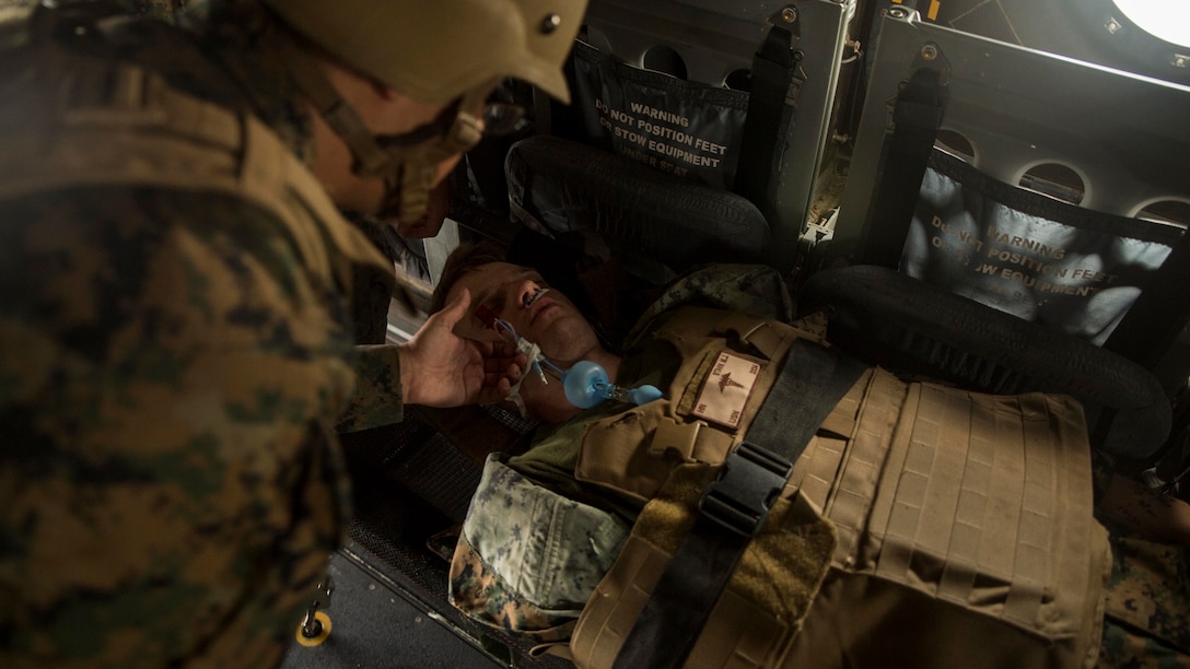 A hospital corpsman assess a simulated patient during a casualty evacuation drill on Marine Corps Air Station Futenma, Okinawa, Japan Dec. 8, 2015. The casevac course is two weeks long and gives the students a better understanding of what it means to be a corpsman. The corpsmen are with various units with III Marine Expeditionary Force.