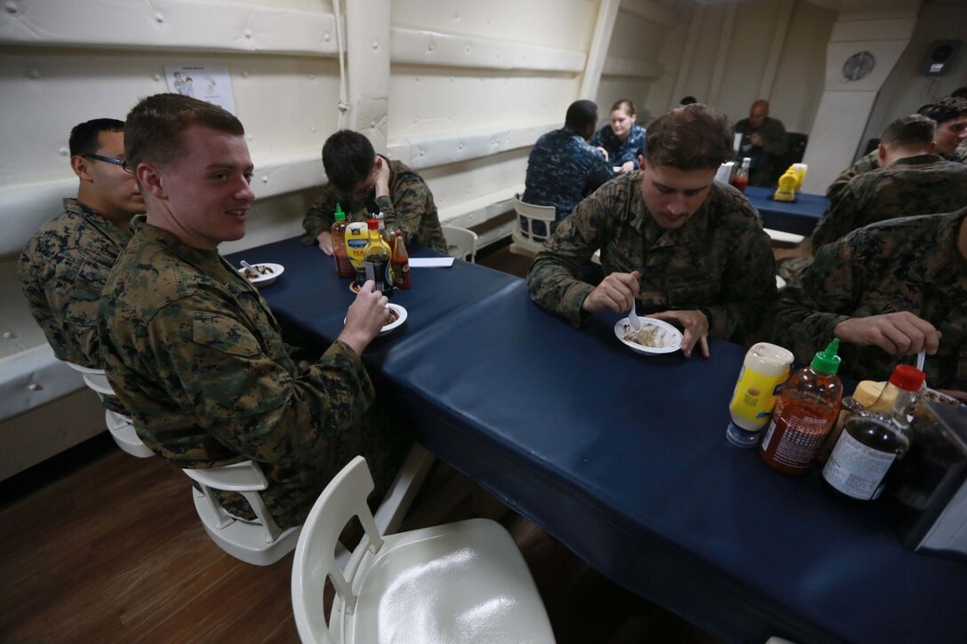 PACIFIC OCEAN (Dec. 9, 2015) U.S. Marines with the 15th Marine Expeditionary Unit enjoy an ice cream social aboard the USS Anchorage (LPD 23). The 15th MEU is coming to the end of deployment and hosting a Tiger Cruise for family members to showcase life aboard the Anchorage. (U.S. Marine Corps photo by Sgt. Steve H. Lopez/Released)