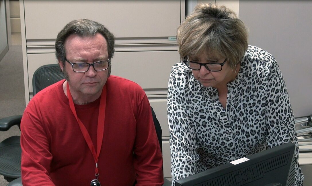 Rick Hopper, U.S. Army Corps of Engineer IT, Operations Officer and Delia Rivera, Nashville District Emergency Management specialist work at a workstation while attending a Crisis Action Team training session in Hendersonville, Tenn.