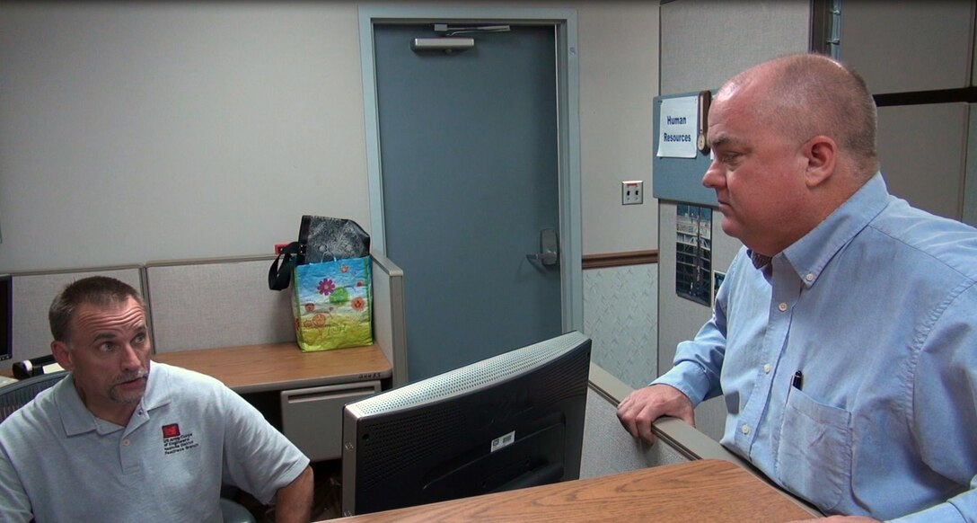 (L to R) Jerry Breznican, Nashville District Emergency Management Branch chief talks with Kevin L. Jasper, acting chief, Programs and Prject Delivery Branch at the Cumberland River Operations Center at OId Hickory Lock and Dam in Hendersonville, Tenn., during Crisis Action Team training. 