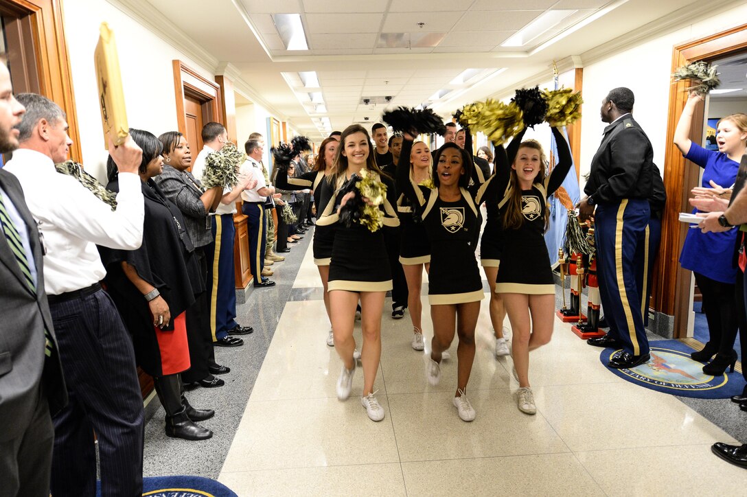 Army Cheerleaders lead a pep rally through the halls of the Pentagon, Dec. 11, 2015, before the upcoming Army-Navy football game. DoD photo by Army Sgt. 1st Class Clydell Kinchen