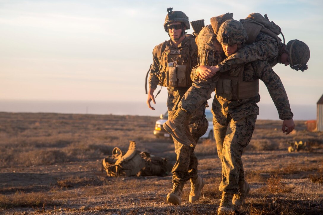 U.S. Marines with Battalion Landing Team 2/1, 13th Marine Expeditionary Unit (MEU), move a simulated casualty to the evacuation site after conducting a mission to secure an airfield and local village during Certificate Exercise (CERTEX) at San Clemente Island, California, Dec. 7, 2015. CERTEX is the final evaluation period of the 13th MEU and Boxer Amphibious Ready Group prior to deployment and is intended to certify their readiness to conduct integrated missions across the full spectrum of military operations. (U.S. Marine Corps photo by Cpl. Briauna Birl/RELEASED)