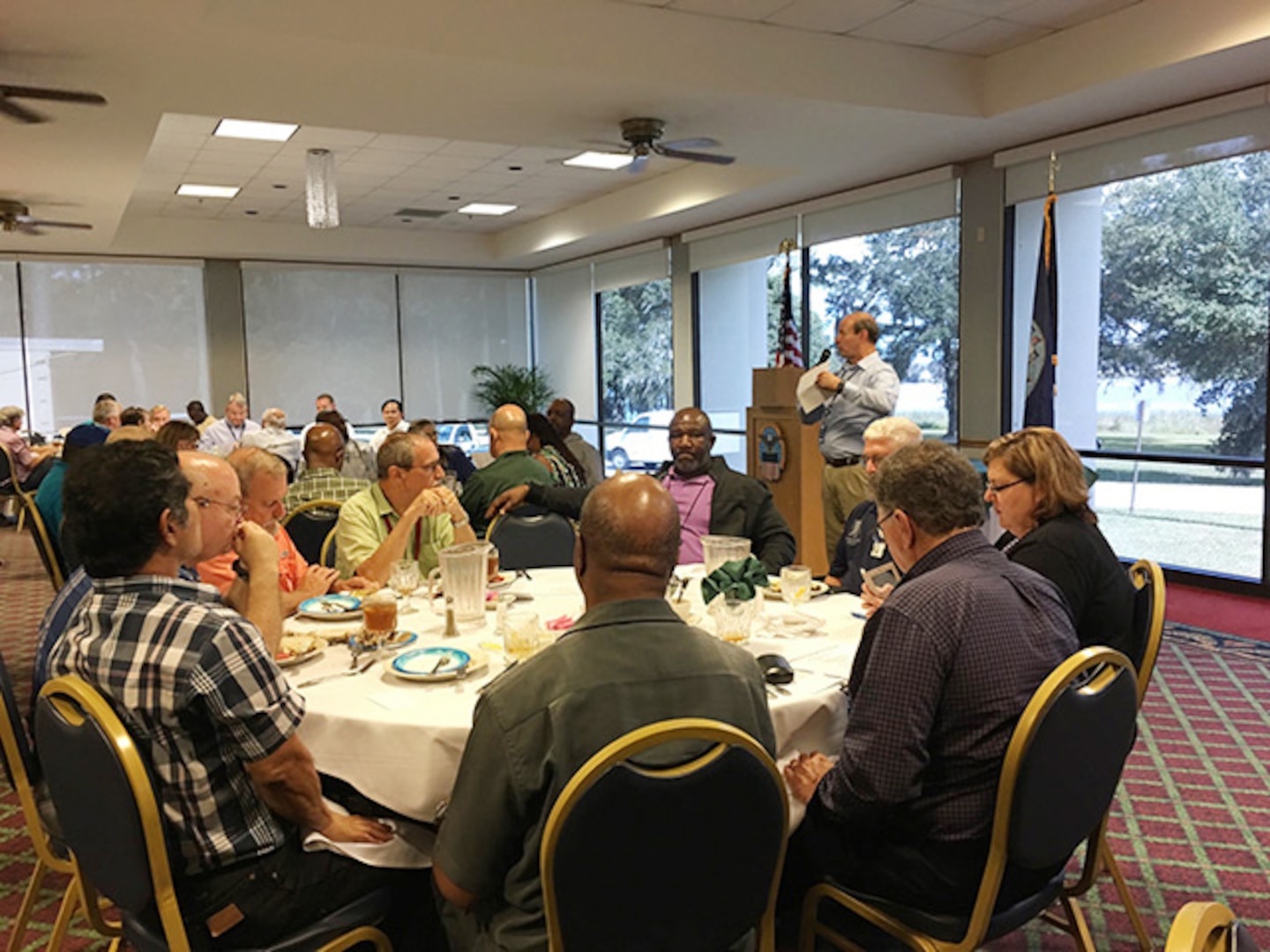 Sylvester Abramowicz, deputy site commander for DLA Aviation at Jacksonville, Florida, gives a historical review of the Inventory Management and Stock Positioning initiative during a two-year, post-deployment luncheon celebration Nov. 5 at Naval Air Station Officers Club.