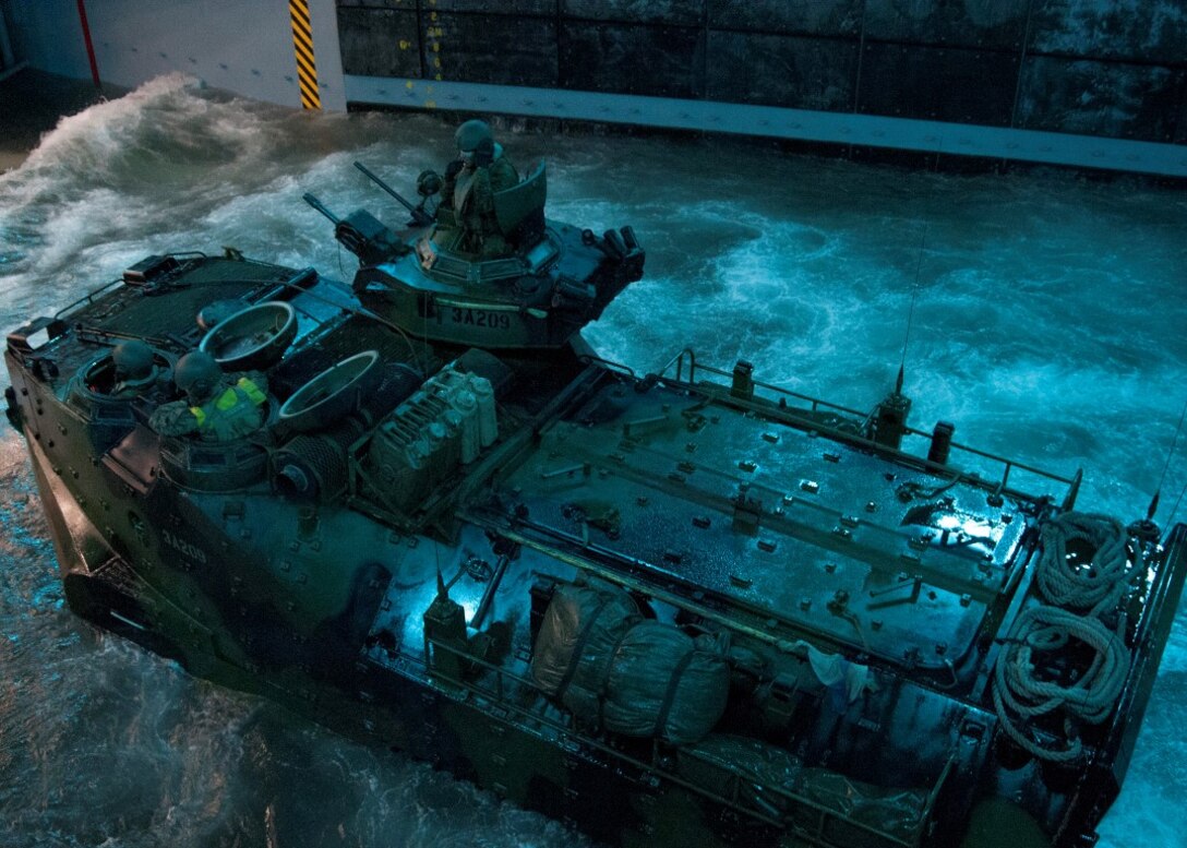 CAMP PENDLETON, Calif. (Dec. 2, 2015) - An amphibious assault vehicle (AAV) enters the well deck of the amphibious transport dock ship USS Somerset (LPD 25), during a well deck operation of AAV’s recovery and onload as part of Exercise Steel Knight 2016. Steel Knight is a 1st Marine Division led exercise which enables the Navy-Marine team to operate in a realistic combined-arms environment to develop skill sets necessary to operate as a fully capable Marine Air Ground Task Force. (U.S. Navy photo by Mass Communication Specialist 1st Class Vladimir Ramos/Released)