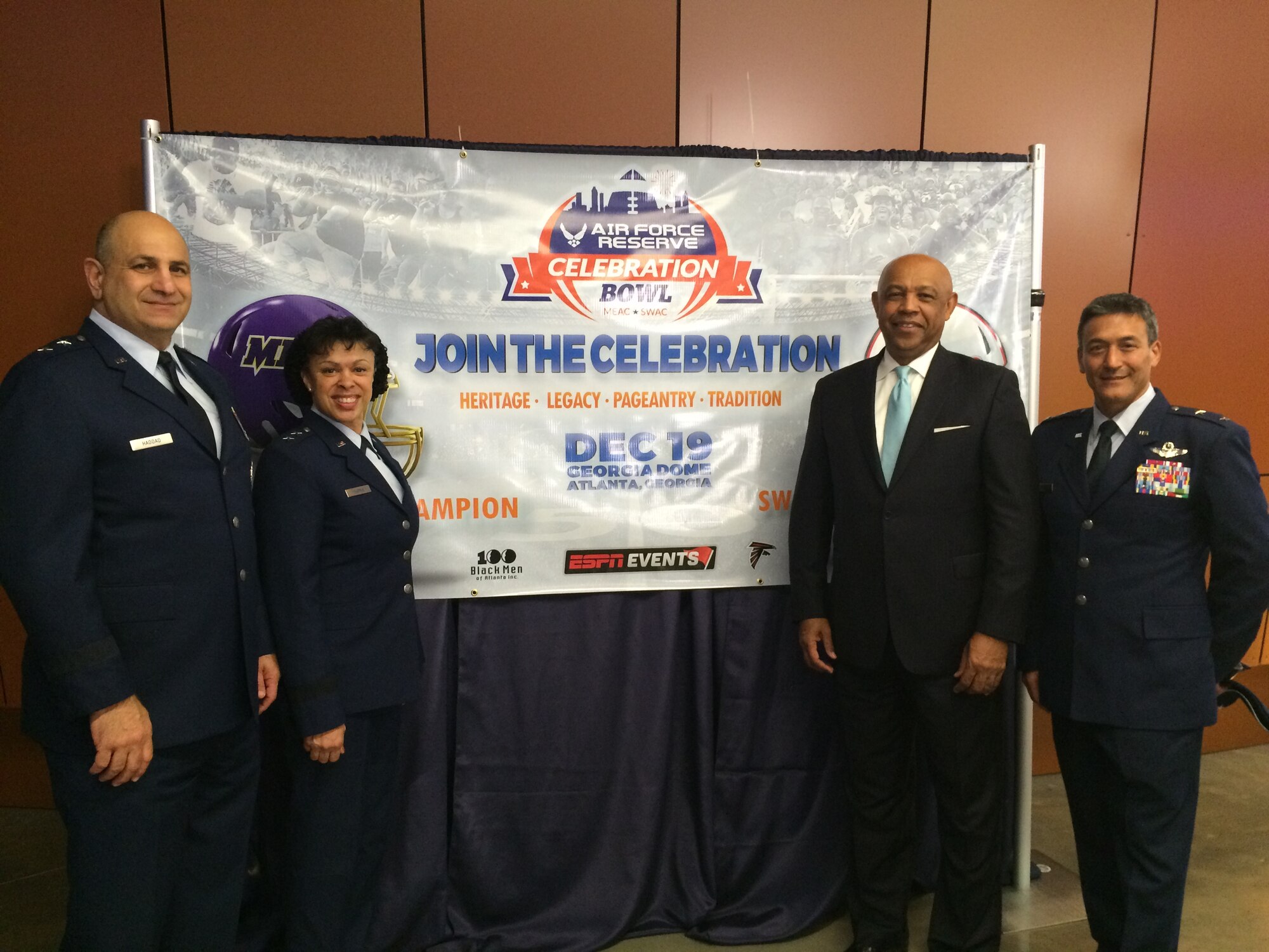 Maj. Gen. Richard S, Haddad, Vice Commander, Air Force Reserve Command; Maj. Gen. Stayce D. Harris, Commander, 22nd Air Force; John Grant, Air Force Reserve Celebration Bowl executive director; Maj. Gen. Michael Kim, Mobilization Assistant to the Commander, U.S. Transportation Command pose for a photo at the 25th Anniversary College Football Awards, which aired live on ESPN on December 10.