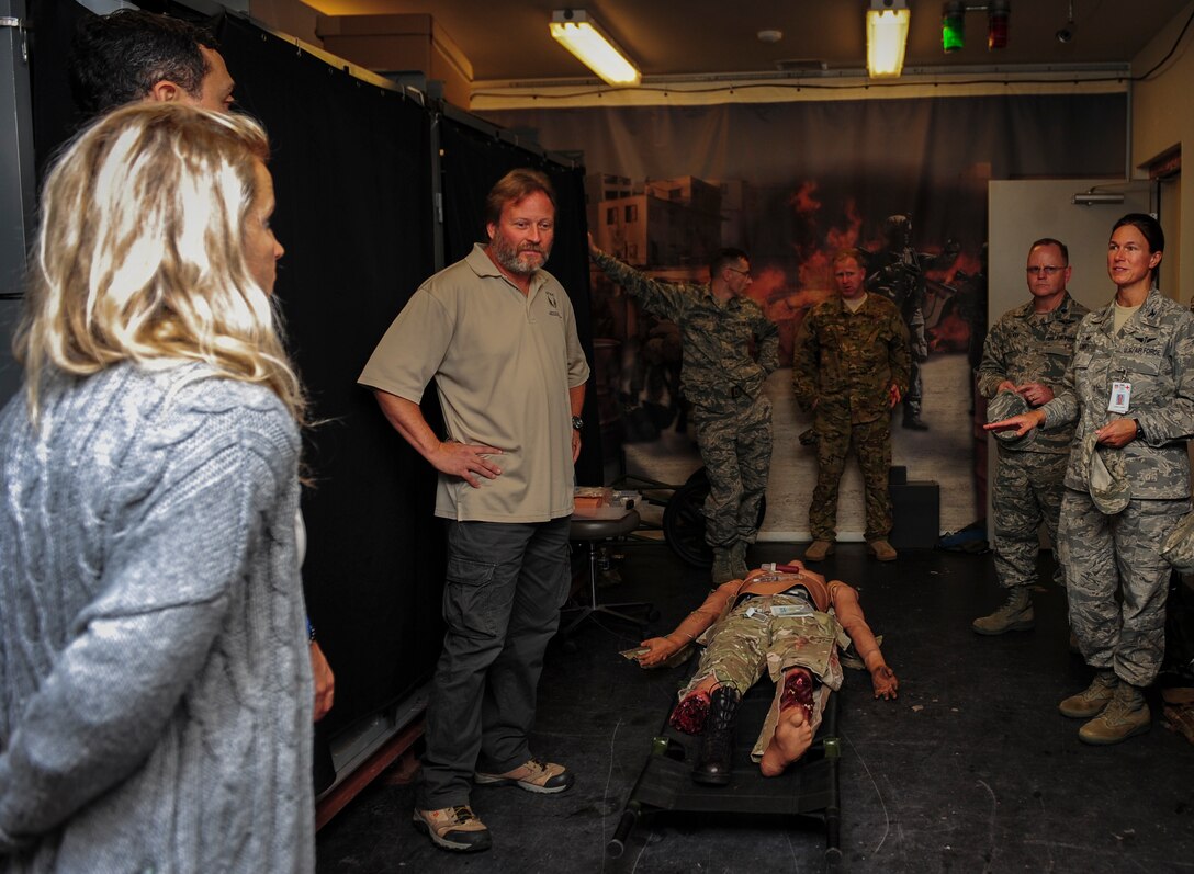 Col. Cheryl Lowry, commander of the 1st Special Operations Medical Group, speaks to Jairek Robbins, a performance coach, and his wife during their visit at Hurlburt Field, Fla., Dec. 9, 2015. During the two-day visit, Robbins met with Airmen around Hurlburt Field to better understand Air Force Special Operations Command's mission and gave a motivational presentation to more than 300 Air Commandos at the end of his visit. (U.S. Air Force photo by Senior Airman Meagan Schutter)