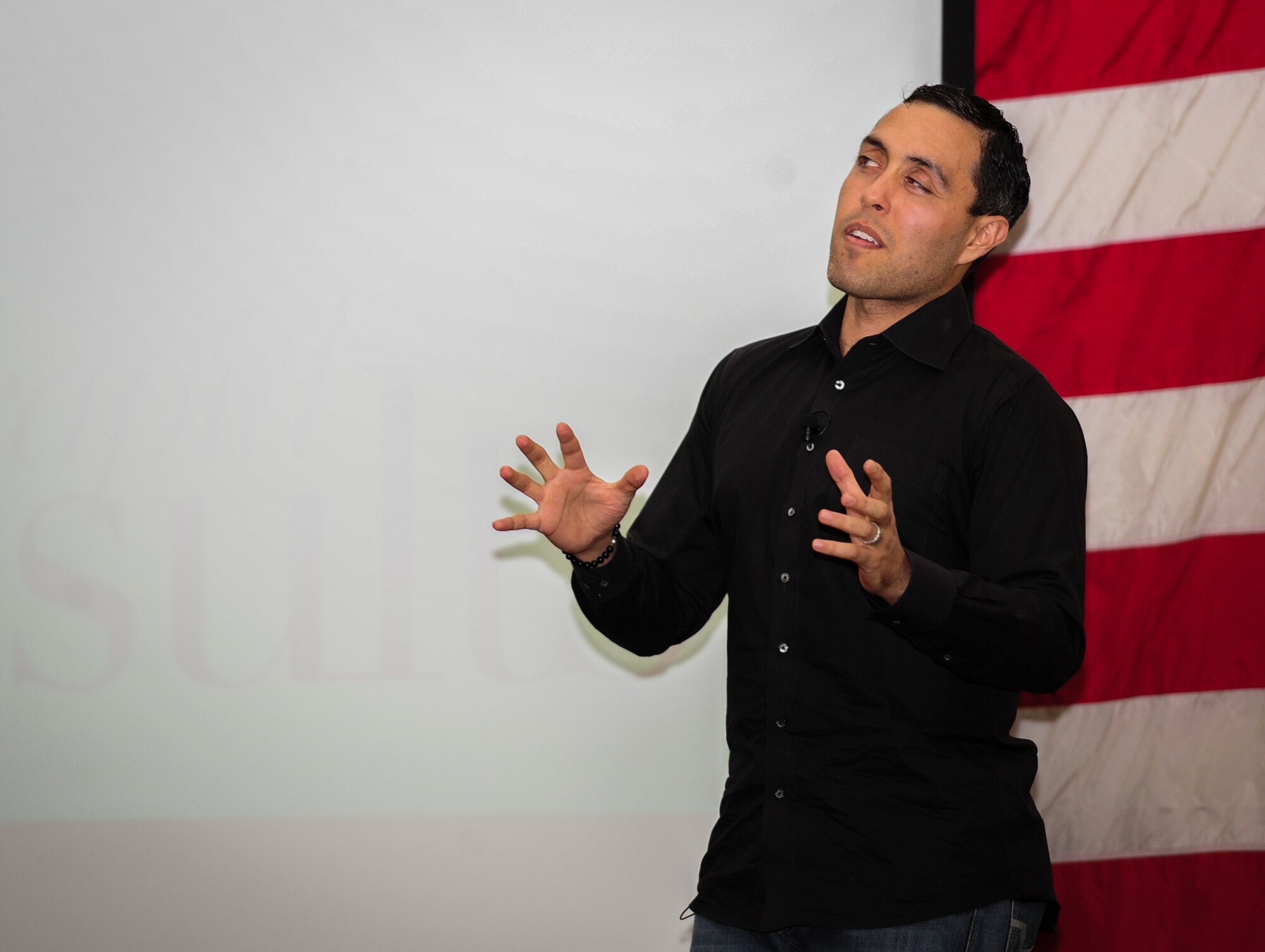 Jairek Robbins, a performance coach, gives a presentation to Airmen at the Soundside Club, Hurlburt Field, Fla., Dec. 9, 2015. During the two-day visit, Robbins met with Airmen around Hurlburt Field to better understand Air Force Special Operations Command's mission and gave a motivational presentation to more than 300 Air Commandos at the end of his visit. (U.S. Air Force photo by Senior Airman Meagan Schutter)