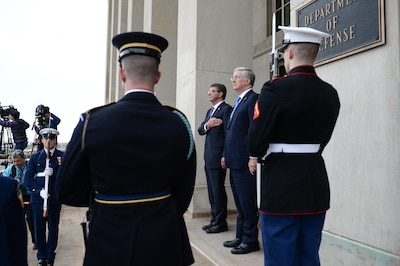Secretary of Defense Ash Carter renders honors during an enhanced honor cordon welcoming the United Kingdom's Secretary of State for Defense Michael Fallon to the Pentagon at the Pentagon River Entrance, Dec. 11, 2015.The defense counterparts spoke on the phone June 24, 2016, and Carter told Fallon the two nations will always enjoy a special relationship reflected in close defense ties -- a bedrock of U.S. security and foreign policy. DoD photo by Army Sgt. 1st Class Clydell Kinchen