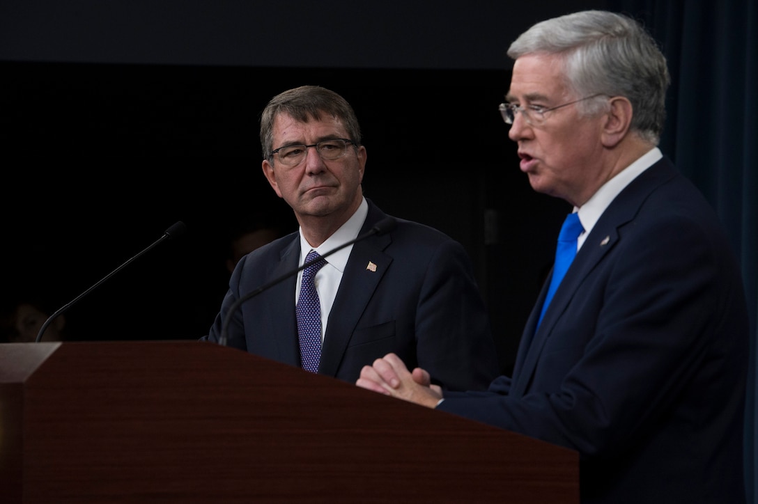 U.S. Defense Secretary Ash Carter listens as British Defense Secretary Michael Fallon speaks during a joint news conference at the Pentagon Dec. 11, 2015, after meeting to discuss matters of mutual interest. DoD photo by Air Force Senior Master Sgt. Adrian Cadiz
