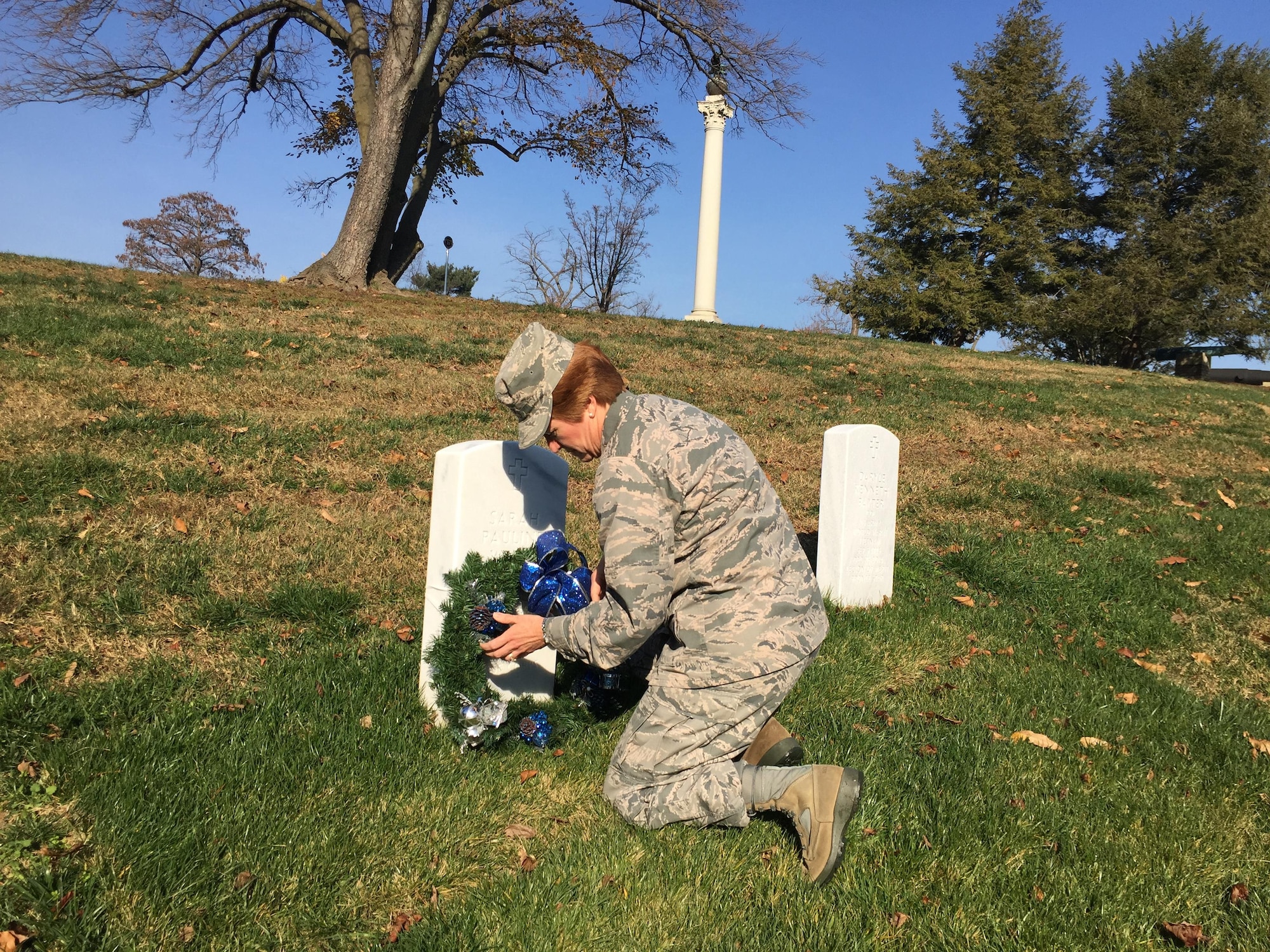 Maj. Gen. Dorothy Hogg, Air Force Deputy Surgeon General and Chief of the Air Force Nurse Corps, lays a wreath on the grave of Brig. Gen. Sally Wells, the 10th Chief of the U.S. Air Force Nurse Corps, who originally started the wreath- laying tradition shortly after she retired in 1982. (U.S. Air Force by Maj. Elisha Parkhill)