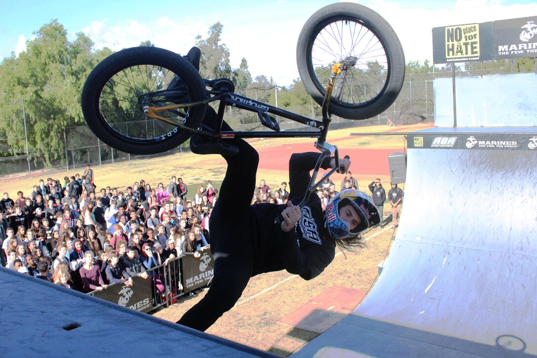 BMX biker Coco Zurita performs a stunt in front of hundreds of students at Calabasas High School during the 2015 ASA High School Tour, Dec. 11. The tour is an interactive “extreme” sports show that visits high schools throughout the United States with several of the world’s top professional skateboarders, BMX bikers and inline skaters delivering an anti-bullying and anti-tobacco message. Recruiters from Recruiting Sub Station Granada Hills also attended the event and held a pull-up and flexed-arm hang challenge. (U.S. Marine Corps photo by Staff Sgt. Alicia R. Leaders/Released)