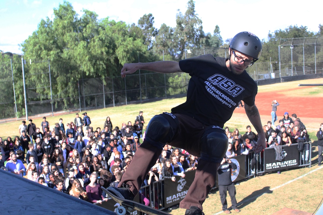Skateboarder Josh Stafford performs a trick on a state-of-the-art pro half-pipe during the 2015 ASA High School Tour, Dec. 11, at Calabasas High School. The tour is an interactive “extreme” sports show that visits high schools throughout the United States with several of the world’s top professional skateboarders, BMX bikers and inline skaters delivering an anti-bullying and anti-tobacco message. Recruiters from Recruiting Sub Station Granada Hills also attended the event and held a pull-up and flexed-arm hang challenge. (U.S. Marine Corps photo by Staff Sgt. Alicia R. Leaders/Released)