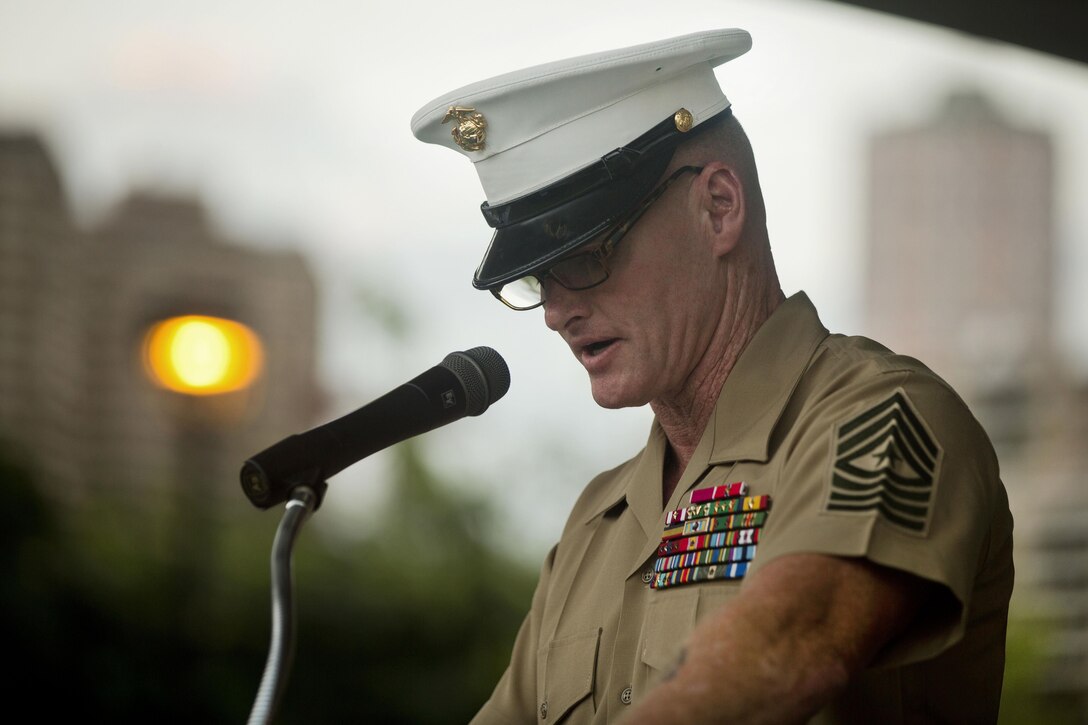 Marine Sgt. Maj. Paul S. McKenna of Marine Corps Forces Pacific delivers remarks during the opening ceremony of the Pearl Harbor Memorial Parade at Fort DeRussy Park in Honolulu, Dec. 7, 2015. Veterans, service members and others marked the 74th anniversary of the attacks on Pearl Harbor and paid respects to those who fought and lost their lives. U.S. Marine Corps photo by Lance Cpl. Miguel Rosales