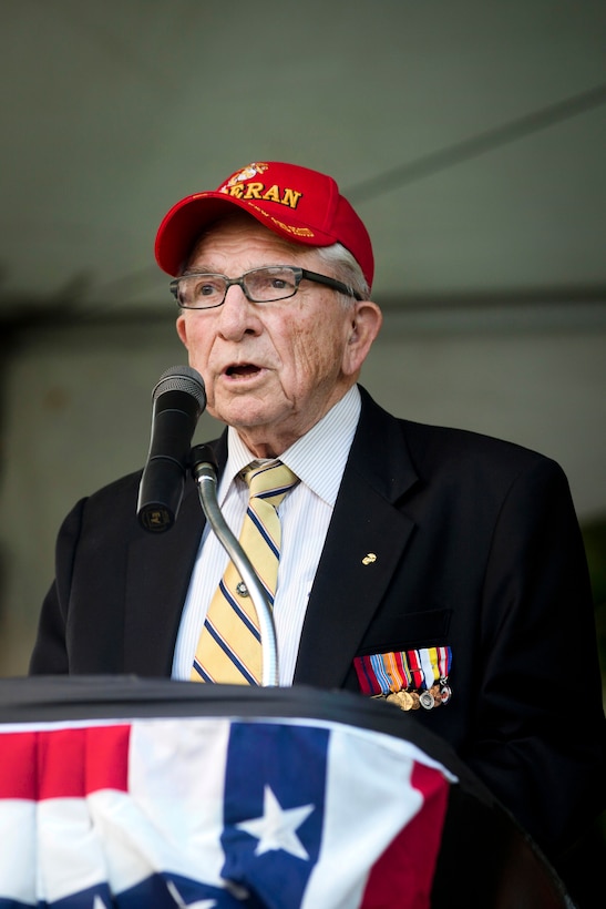 World War II veteran Bruce Heilman, a survivor of the attacks on Pearl Harbor, gives a speech during the opening ceremony of the Pearl Harbor Memorial Parade at Fort DeRussy Park in Honolulu, Dec. 7, 2015. Heilman enlisted in the U.S. Marine Corps in 1944 at age 17, as a tail gunner. U.S. Marine Corps photo by Lance Cpl. Miguel Rosales