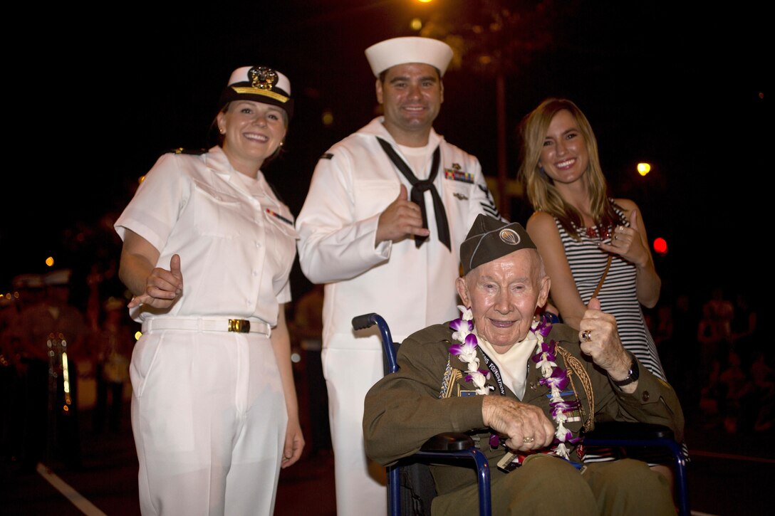 World War II veteran Joe Reilly, a survivor of the attacks on Pearl Harbor, poses for a photograph during the Pearl Harbor Memorial Parade at Fort DeRussy Park in Honolulu, Dec. 7, 2015. U.S. Marine Corps photo by Lance Cpl. Miguel Rosales