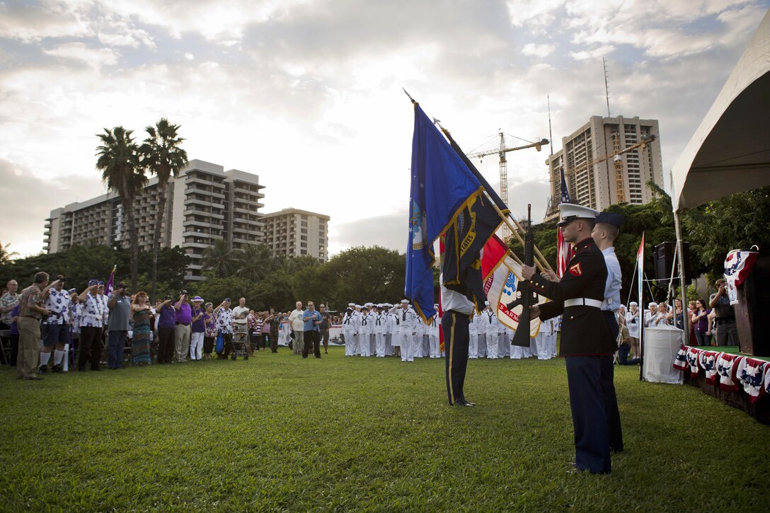 A joint color guard presents the colors during the opening ceremony of the Pearl Harbor Memorial Parade on Fort DeRussy Park, in Honolulu Dec. 7, 2015. U.S. Marine Corps photo by Lance Cpl. Miguel Rosales