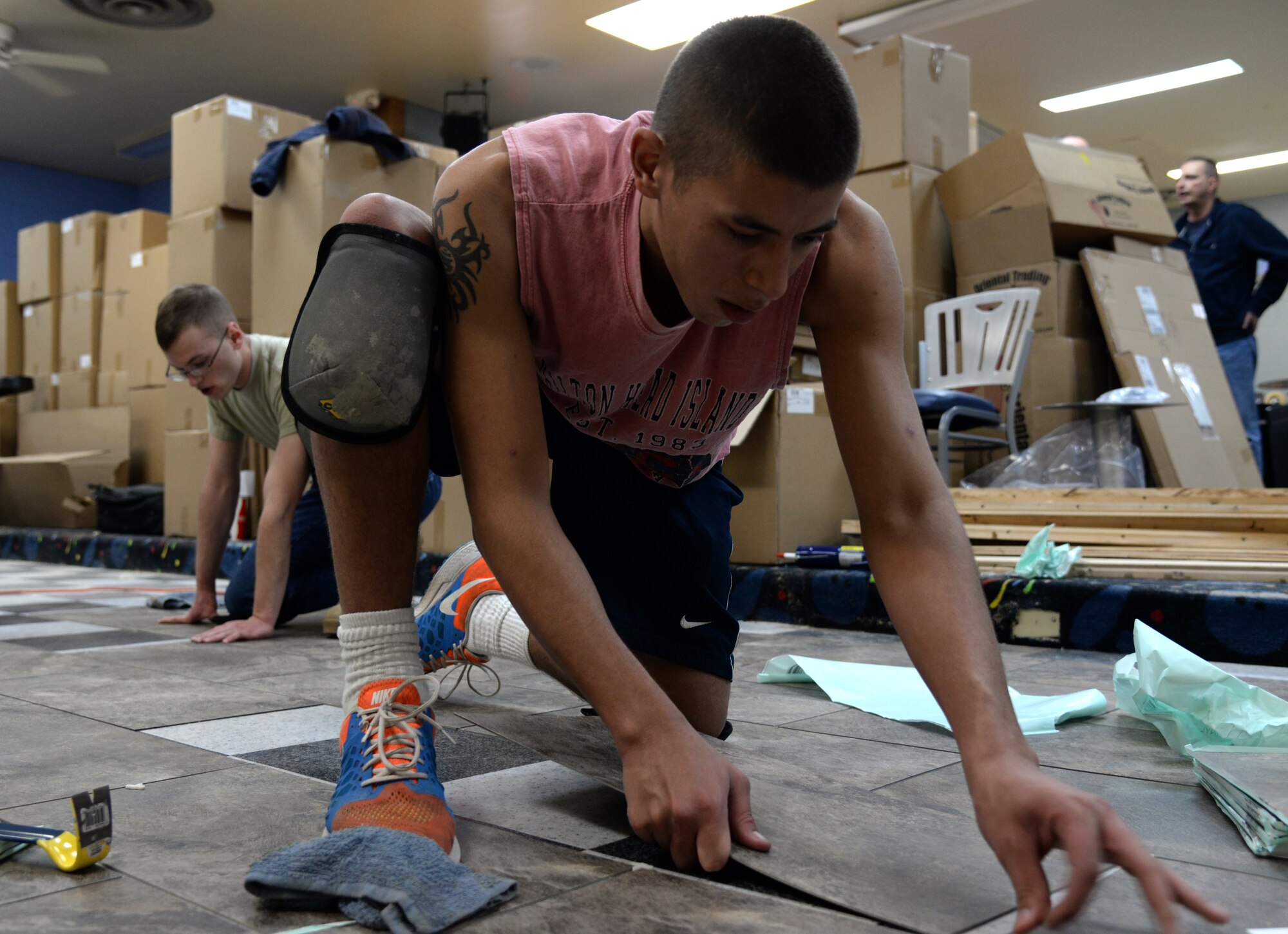 Jean Sall, left, and Cerrina Smith, right, 90th Force Support Squadron members, decorate a wall in the Warren Bowling Center on F.E. Warren Air Force Base, Wyo., Dec. 10, 2015. Sall and Smith decorated most of the interior of the newly renovated bowling center. (U.S. Air Force photo by Airman 1st Class Malcolm Mayfield)