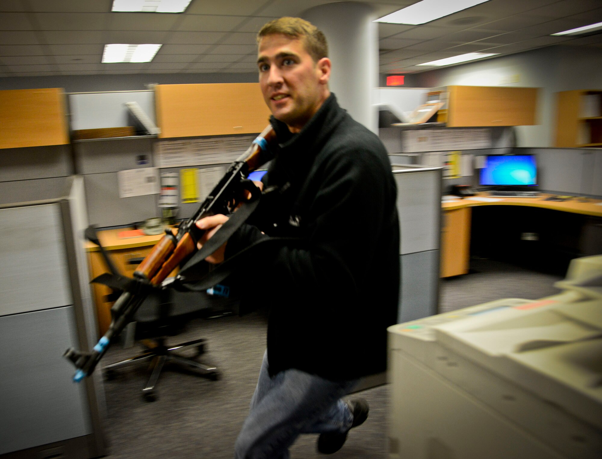 Master Sgt. Andrew Farris, 51st Security Forces Squadron defender, plays an active-shooter during an internal exercise on Osan Air Base, Republic of Korea, Dec. 10, 2015. The active shooter exercises and training allows both the defenders and the squadrons associated to train in the event of a real-world incident. (U.S. Air Force photo/Senior Airman Kristin High)
