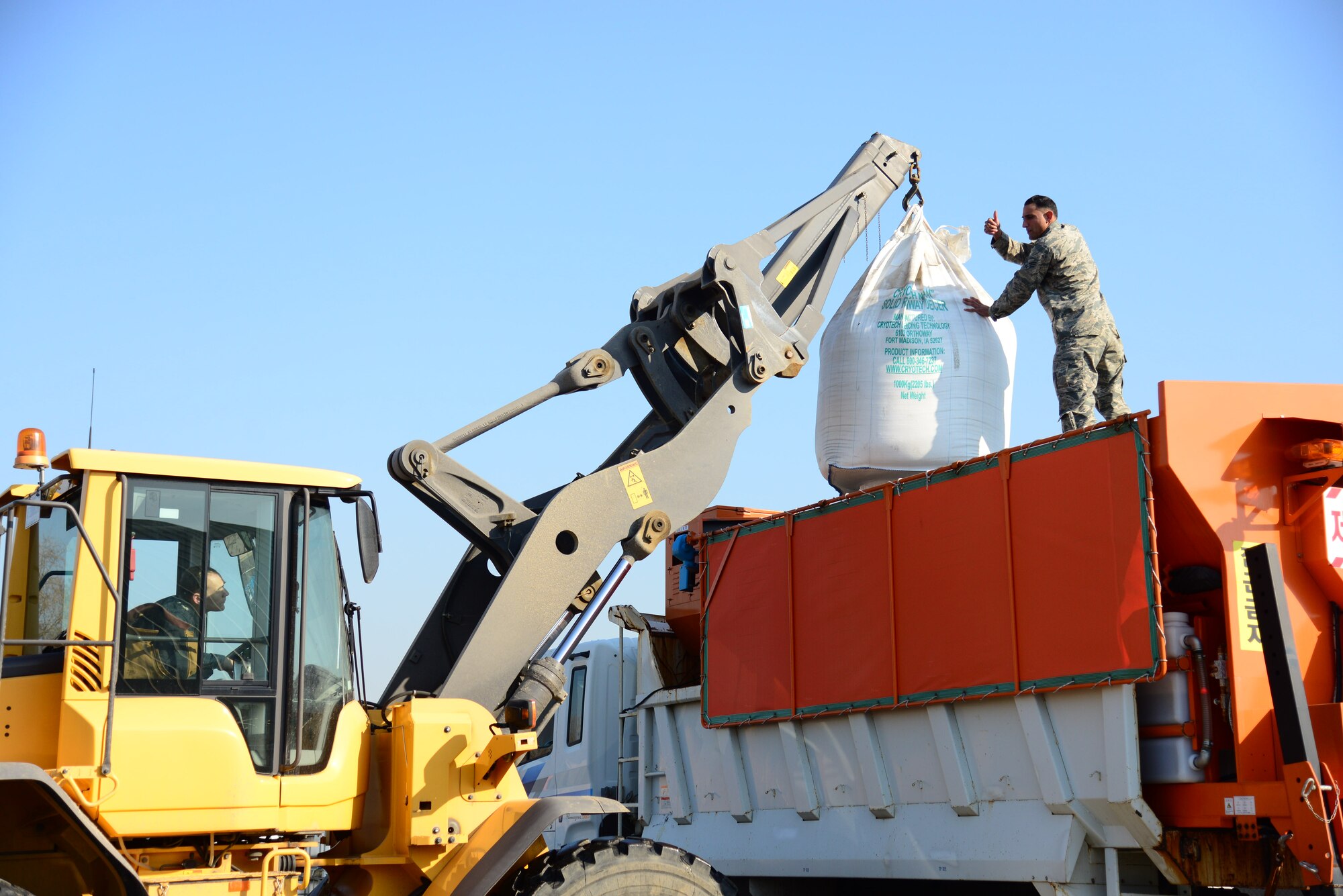 Pavement and construction equipment Airmen from the 51st Civil Engineer Squadron fill the back of a dump truck with deicing chemicals at Osan Air Base, Republic of Korea, Dec. 8, 2015.  When mixed with sand, the chemicals will be used to keep the streets clear during the winter season. Prepping the trucks during clear weather ensures the ability to respond immediately should inclement weather strike the base. (U.S. Air Force photo/Staff Sgt. Amber Grimm)