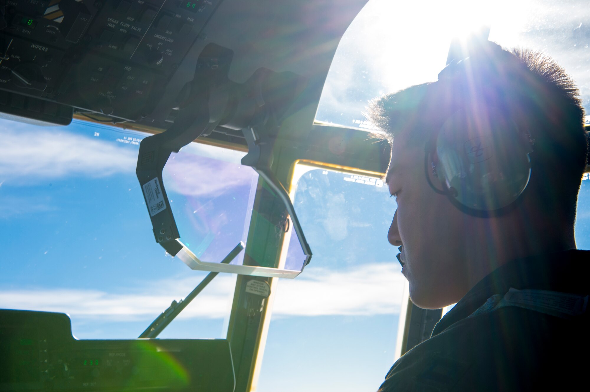 U.S. Air Force Capt. Andrew Kim, 71st Rescue Squadron pilot, flies an HC-130J Combat King II, Dec. 11, 2015, in the skies over south Ga. Prior to accepting the aircraft, aircrew and maintenance personnel perform an in-depth preflight check. (U.S. Air Force photo by Senior Airman Ryan Callaghan/Released)