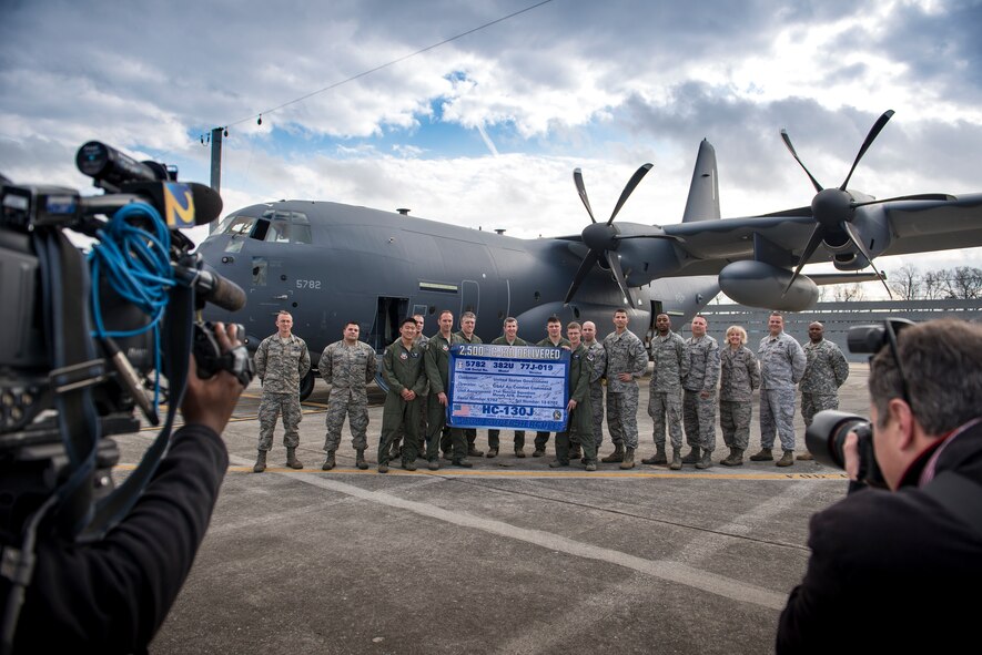 Airmen from the 71st Rescue Squadron, the 71st Aircraft Maintenance Unit and the Defense Contract Management Agency pose for a photo in front of an HC-130J Combat King II, Dec. 11, 2015, at the Lockheed Martin C-130 ramp in Marietta, Ga. The HC-130J, tail number 13-782, is the 2,500th C-130 delivered by Lockheed Martin. (U.S. Air Force photo by Senior Airman Ryan Callaghan/Released)