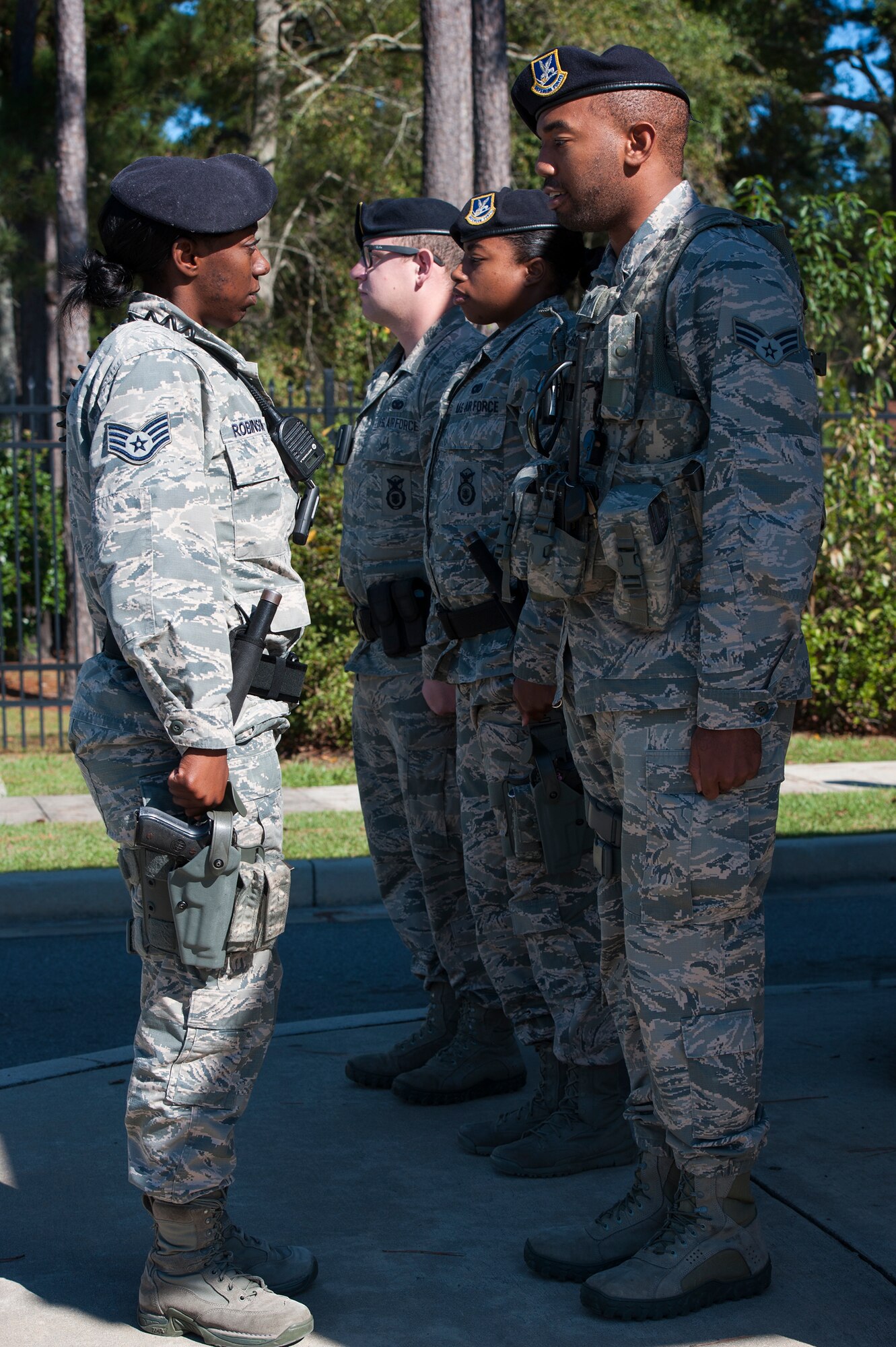 U.S. Air Force Staff Sgt. Claudia Robinson, 23d Security Forces Squadron 30a-2 flight chief, conducts a post-check with Airmen at the housing gate, Nov. 11, 2015, at Moody Air Force Base, Ga. The Airmen explain their duties to the flight chief and report any issues during the post-check. (U.S. Air Force photo by Airman 1st Class Kathleen D. Bryant/Released)
