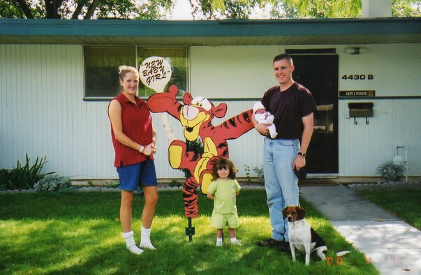 From right to left: Col. Jack Fischer, daughters Sariah and Bethany, and wife Elizabeth 
pose for a photo in front of their home in 2000, at Mountain Home Air Force Base,
Idaho. Fischer was a fighter pilot with the 391st Fighter Squadron Bold Tigers
from 2000 to 2003. (Courtesy Photo)