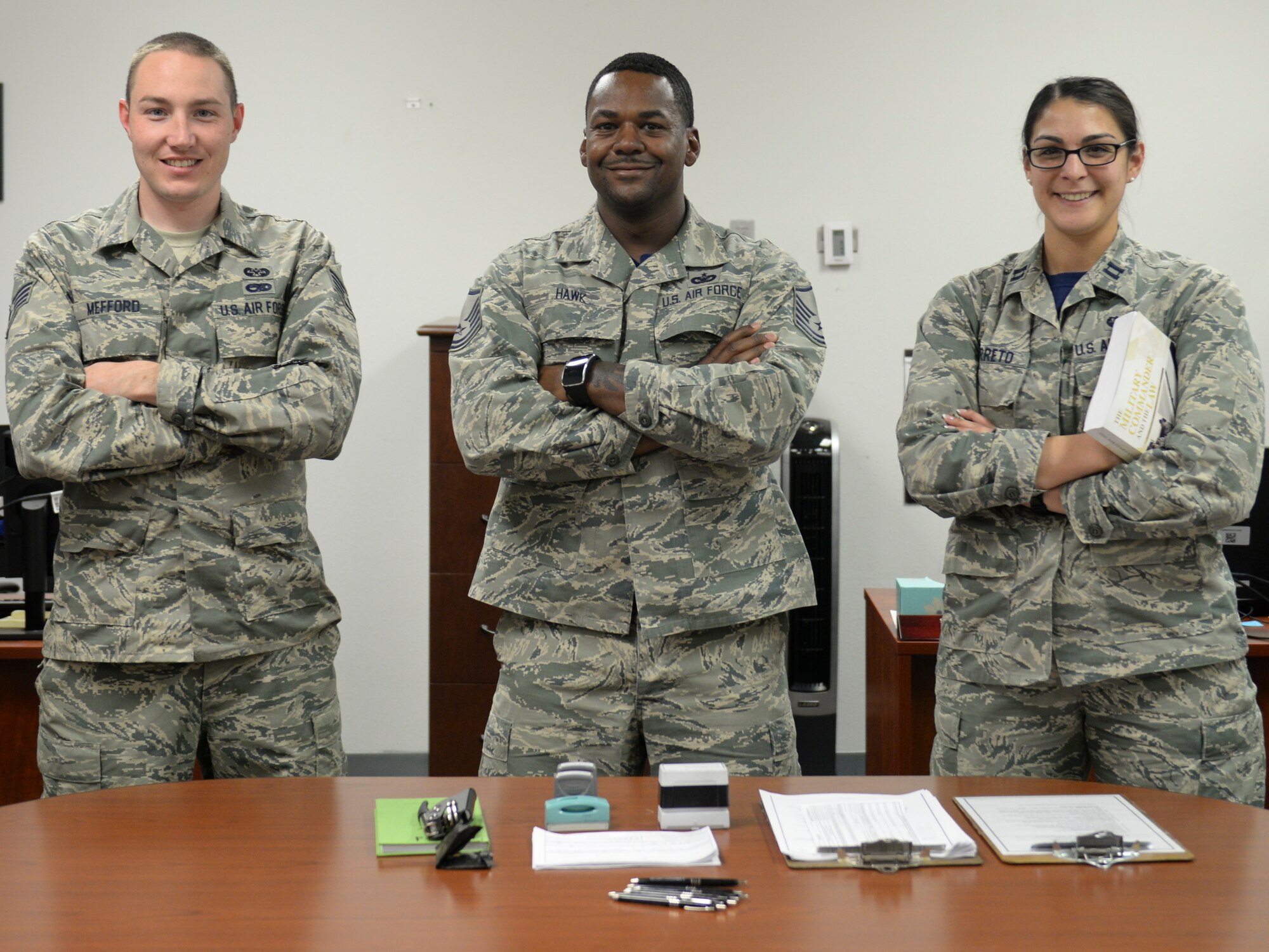 Staff Sgt. Timothy Mefford, a 49th Judge Advocate paralegal, Master Sgt. Bryan Hawk, the noncommissioned officer in-charge of Judge Advocate training and readiness, and Capt. Amanda Barreto, the 49th Wing legal assistance and preventive law chief of operations, are the members of the Legal Hawks Outreach Program who made an visit to the 49th Material Maintenance Support Squadron at Holloman Air Force Base, New Mexico on Dec. 4. The outreach program was created to provide quality legal assistance to those who were having difficulty making it to the legal office. (U.S. Air Force photo by Staff Sgt. E’Lysia A. Wray)