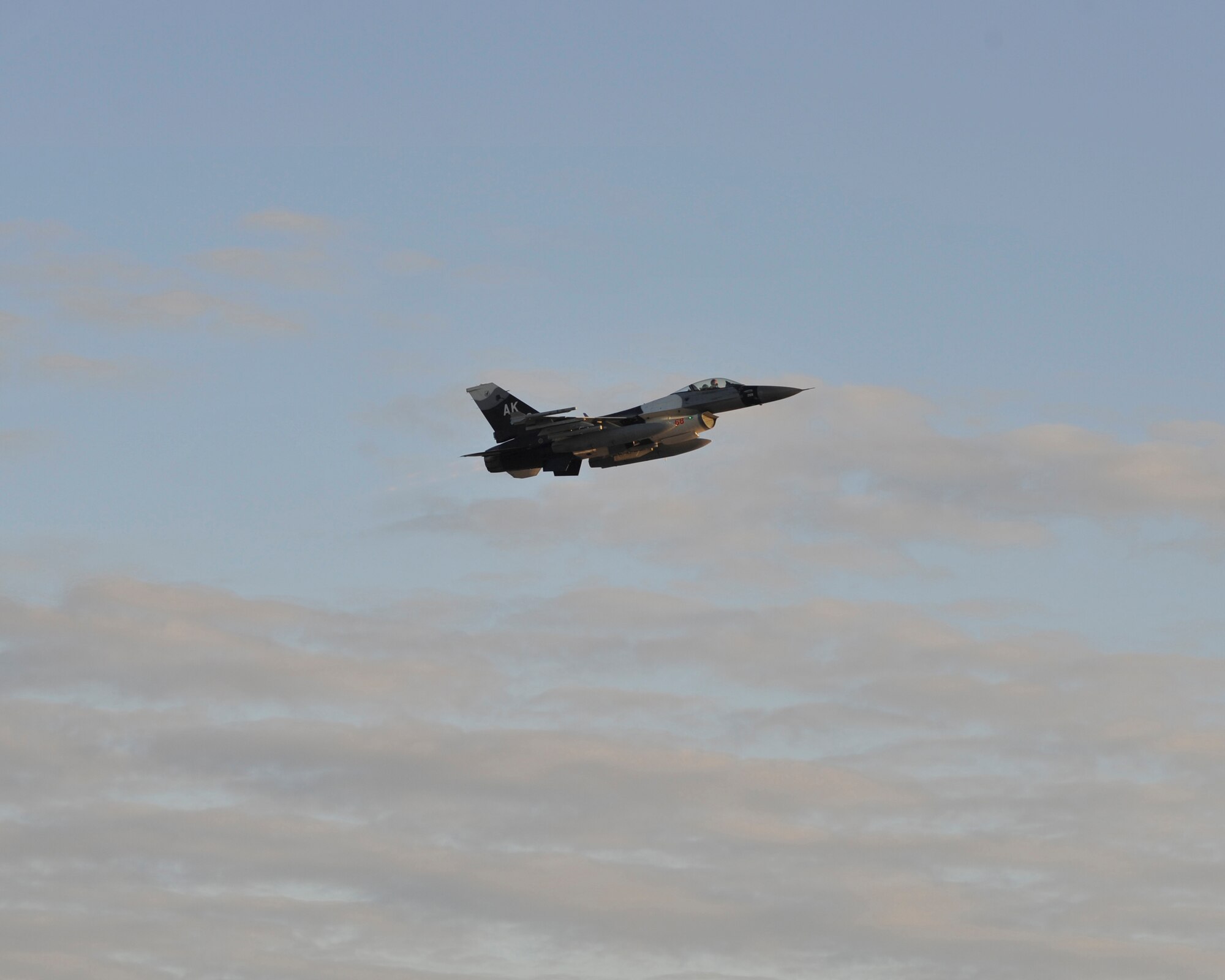 An F-16 Falcon from Eielson Air Force Base, Ak. departs from Tyndall Air force Base, Fla. Dec. 10 during Checkered Flag 16-1. Checkered Flag is a large-force exercise that simulates employment of a large number aircraft from a simulated deployed environment. (U.S. Air Force photo by Senior Airman Sergio A. Gamboa/Released)