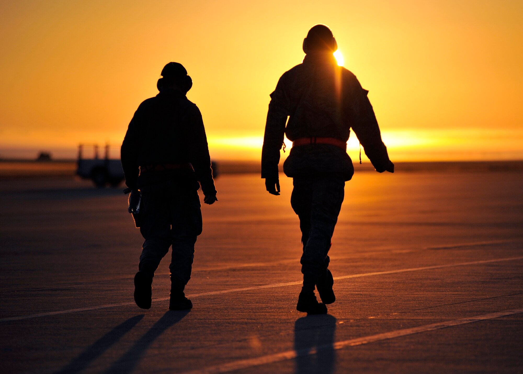 Two 77th Aircraft Maintenance Unit aircraft armarment members from Shaw Air Force Base. S.C. walk down the Tyndall AFB, Florida flightline Dec. 10 during Checkered Flag 16-1. Airmen from Shaw AFB were at Tyndall for the Weapons System Evaluation Program and Checkered Flag 16-1. (U.S. Air Force photo by Senior Airman Sergio A. Gamboa/Released)