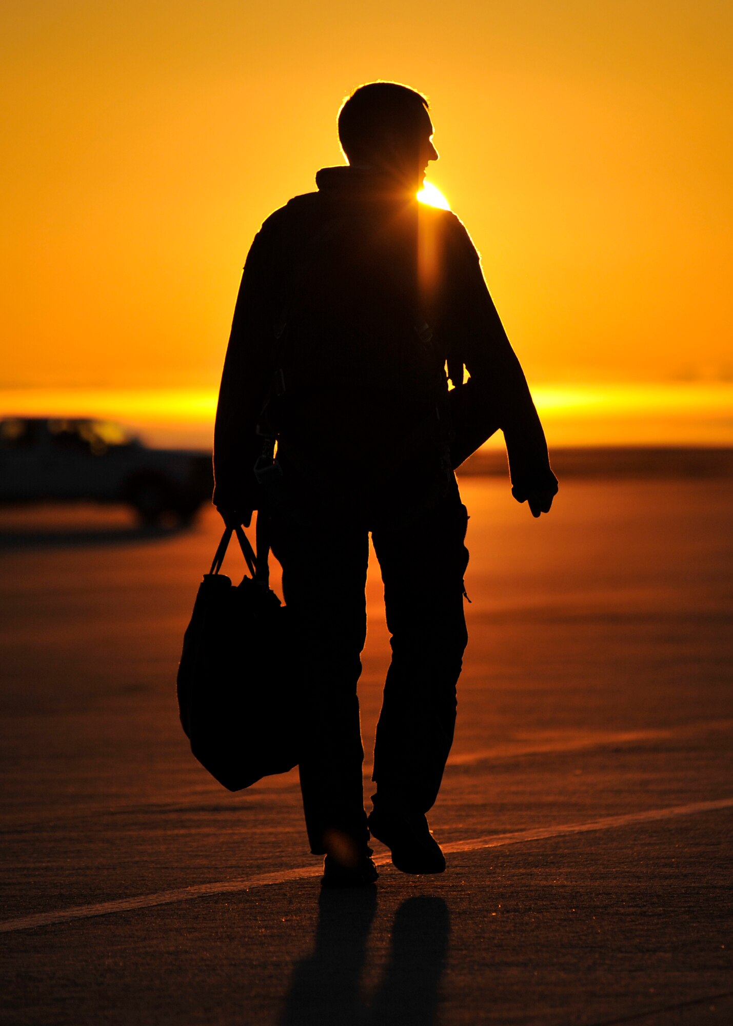 An F-16 Falcon pilot from Shaw Air Force Base, S.C. walks down the Tyndall AFB, Fla. flightline Dec. 10 during Checkered Flag 16-1. Airmen and aircraft from Shaw AFB came to Tyndall to participate in the 53rd Weapons Evaluation Group’s Weapons System Evaluation Program and Checkered Flag 16-1.  (U.S. Air Force photo by Senior Airman Sergio A. Gamboa/Released)