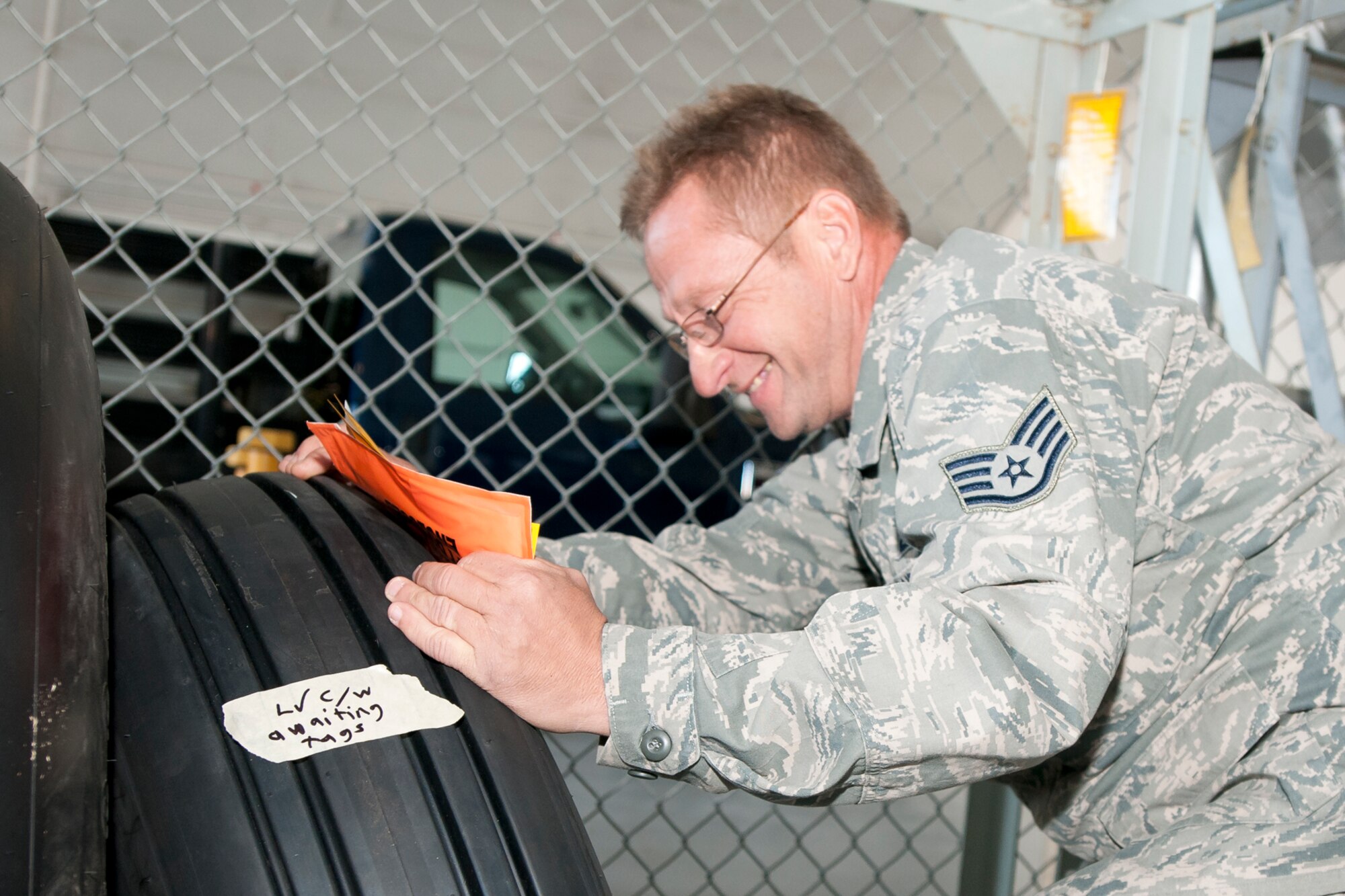 Staff Sgt. Joseph Spangler, 459th Maintenance Squadron crew chief, inspects a nose landing gear wheel assembly tire for proper bolt thread protrusion, washers, bearings, cups, cones, rollers and valve caps inside a 459th Air Refueling Wing hangar on Joint Base Andrews, Md., Dec. 6, 2015, after returning to the shop for repair. Tires in need of repair are broken down, cleaned and sent to a non-destructive repair shop. Then, the 459 MXS rebuilds and inspects the wheel hardware and adds the wheel assembly back into the Air Force supply system. (U.S. Air Force photo by Staff. Sgt. Kat Justen) 