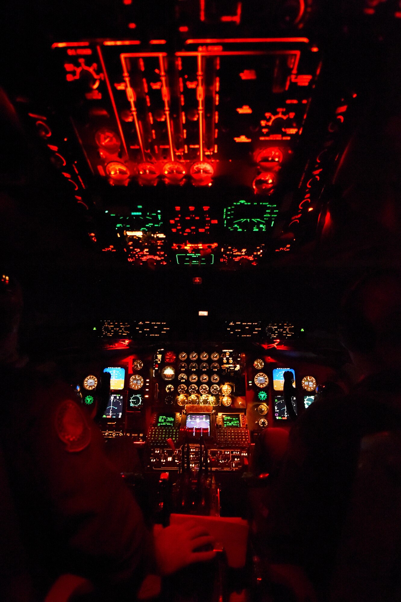 Lights from the cockpit of a KC-135R Stratotanker from the 434th Air Refueling Wing at Grissom Air Reserve Base, Ind. shine bright during a nighttime aerial refueling mission over Southern Kansas, Oct. 21, 2015. Pilots rely on illuminated instruments to help fly the aircraft during missions after dark. (U.S. Air Force photo/Tech. Sgt. Benjamin Mota)