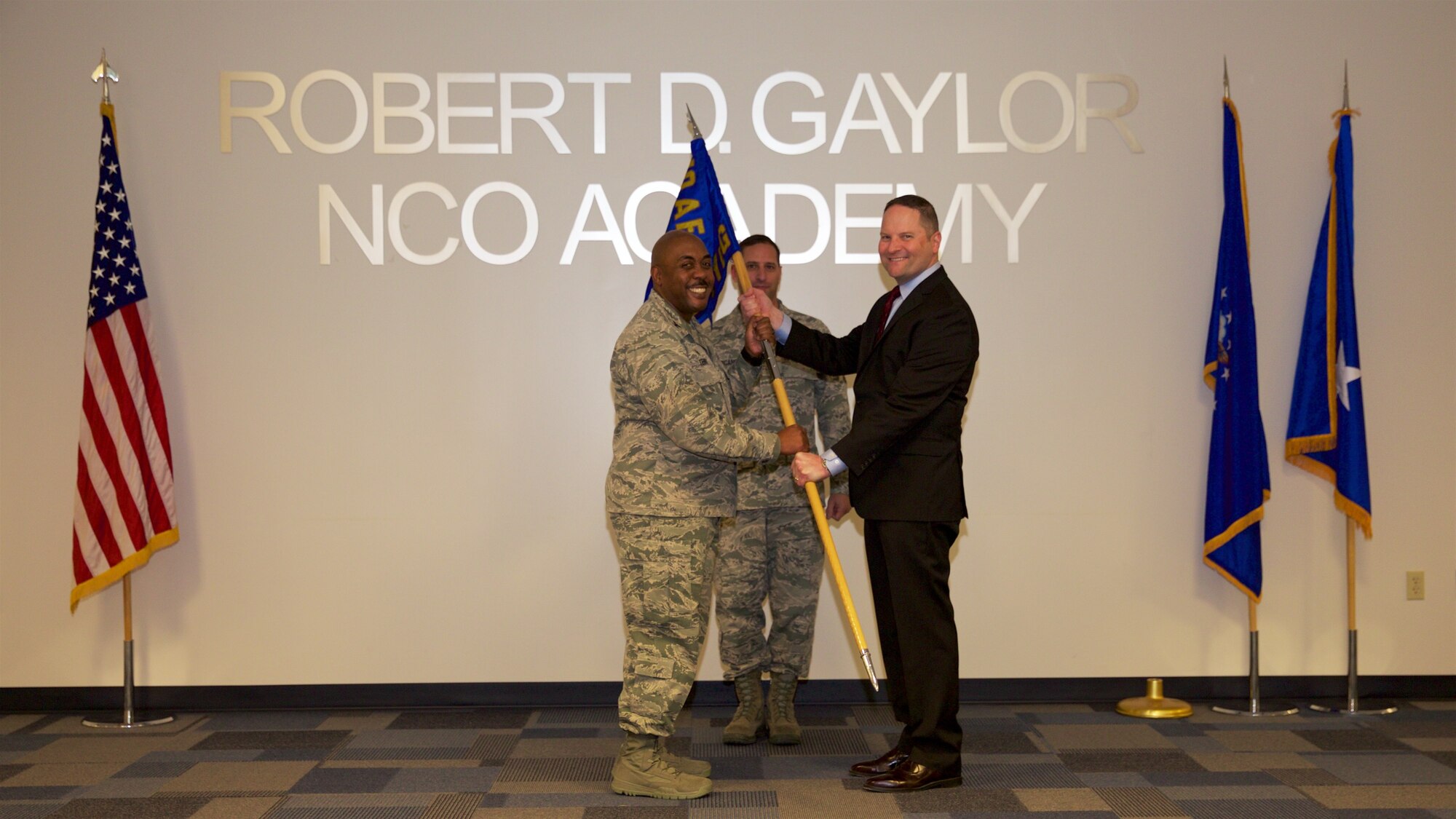 Col. Lloyd Terry, Jr., 960th Cyberspace Operations Group commander, and David Neuman, the 960th CyOG's new honorary commander, pose for a photo during an honorary change of command ceremony Dec. 5 at the Robert D. Gaylor NCO Academy Auditorium. Neuman is the Senior Director of Information Security Operations at Rackspace Headquarters here in San Antonio, Texas. (U.S. Air Force Photo/Tech. Sgt. Miguel Naranjo) 
