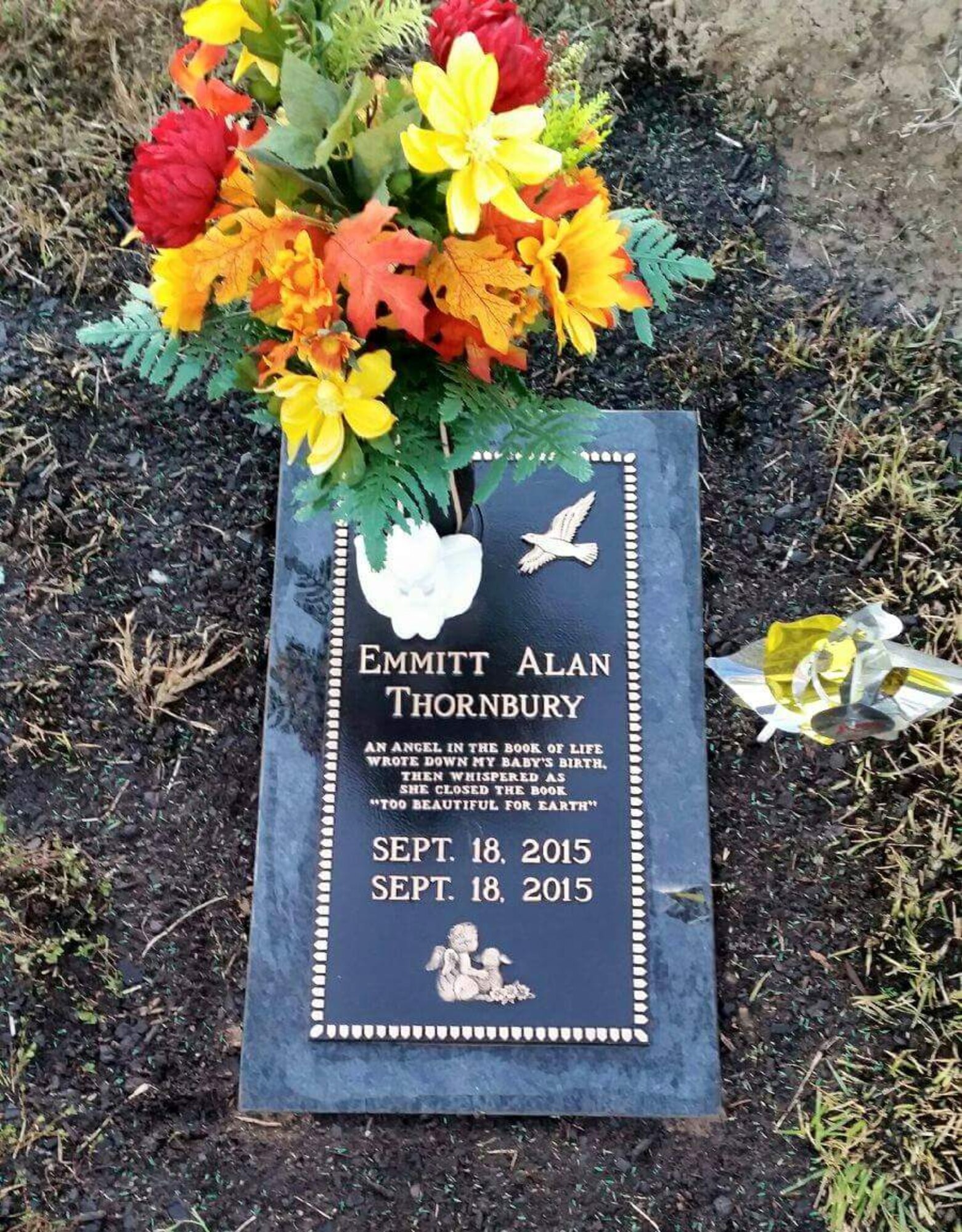A picture shows the headstone of Emmitt Alan Thornbury, son of Airman 1st Class Christopher Thornbury, 22nd Air Refueling Wing Public Affairs photojournalist, laid to rest in Lebanon, Mo. Emmitt passed away as a result of his deformities caused by his condition, Trisomy 18. (Courtesy photo)