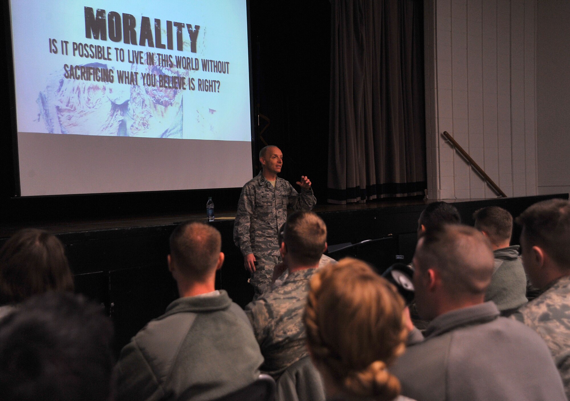Chaplain (Capt.) Thomas West, 319th Air Base Wing chaplain, leads the “Walking with the Dead” seminar during Spiritual Wingman Day on Grand Forks Air Force Base, North Dakota, Dec. 10, 2015. During the seminar, West used zombies to discuss the topics of morality, mortality and humanity. (U.S. Air Force photo by Senior Airman Grantham/released)