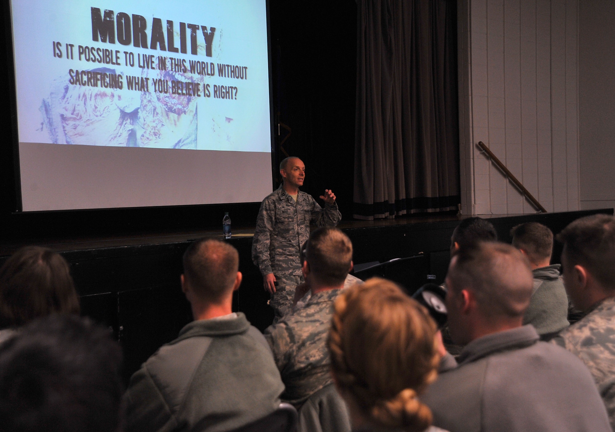 Chaplain (Capt.) Thomas West, 319th Air Base Wing chaplain, leads the “Walking with the Dead” seminar during Spiritual Wingman Day on Grand Forks Air Force Base, North Dakota, Dec. 10, 2015. During the seminar, West used zombies to discuss the topics of morality, mortality and humanity. (U.S. Air Force photo by Senior Airman Grantham/released)