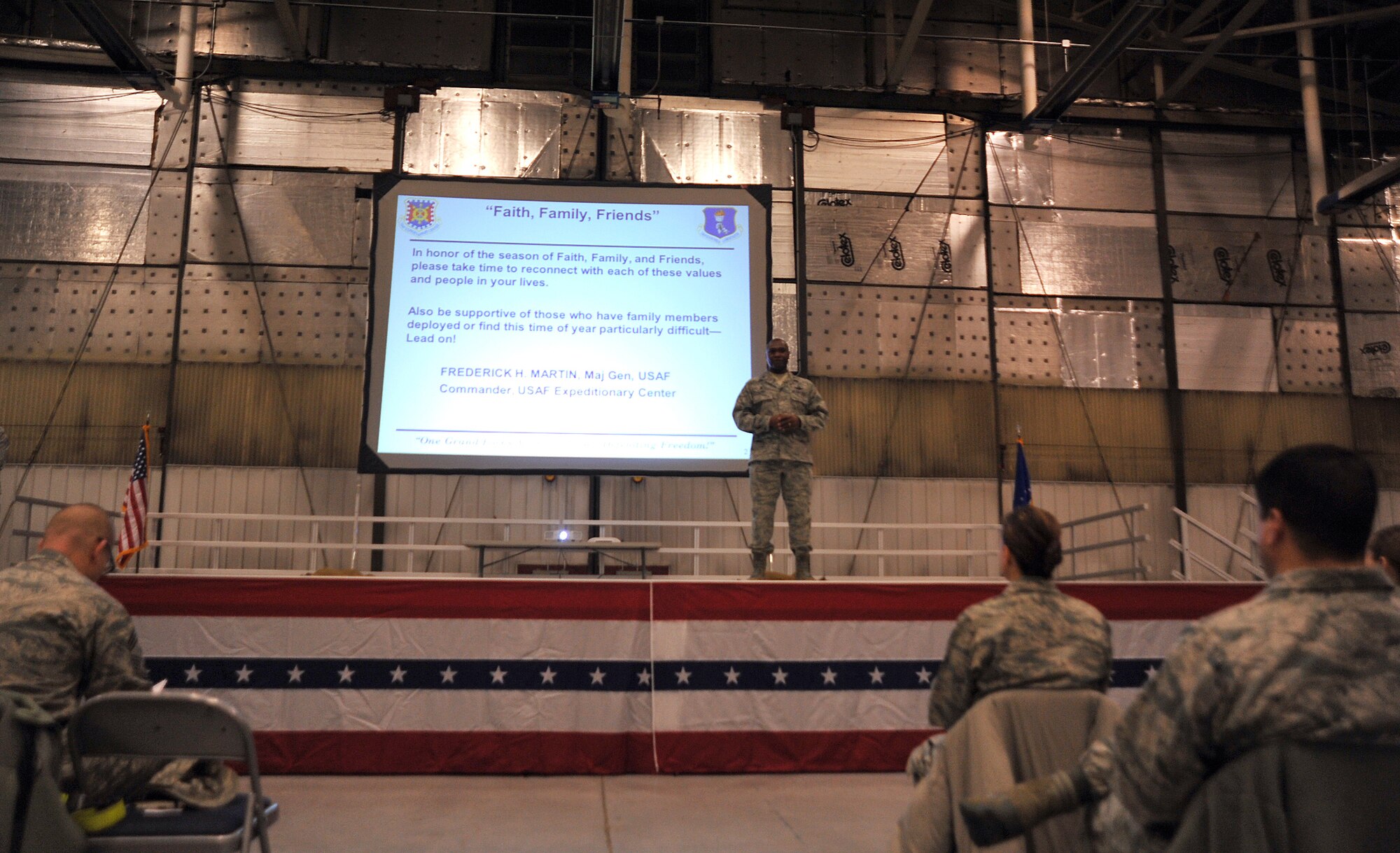 Col. Rodney Lewis, 319th Air Base Wing commander, discusses the importance of faith, family and friends with Warriors of the North during a commander’s call for the Spiritual Wingman Day on Grand Forks Air Force Base, North Dakota, Dec. 10, 2015. Lewis stressed the importance of having faith in each other as the holiday season begins. (U.S. Air Force photo by Senior Airman Bonnie Grantham/released)