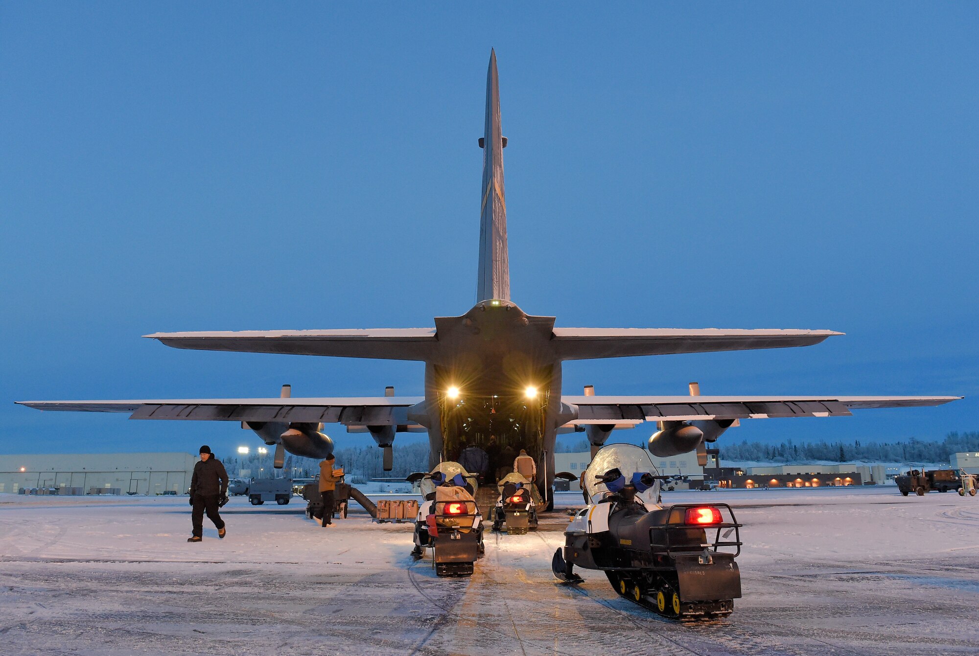 JOINT BASE ELMENDORF-RICHARDSON, Alaska -- U.S. Marines assigned to Delta Company, 4th Law Enforcement Battalion, deliver toys to children living in remote villages of Alaska as part of the Toys for Tots program, Dec. 8. After traveling to a remote hub of villages via aircraft provided by the 144th Airlift Squadron, Alaska Air National Guard, the Marines travel to different villages on snow machines. This year three teams of Marines traveled to numerous villages in the vicinities of Kotzebue, Galena and McGrath. Toys for Tots is a program run by the United States Marine Corps Reserve with a goal of delivering, through a new toy at Christmas, a message of hope to less fortunate youngsters that will assist them in becoming responsible, productive and patriotic citizens. (U.S. Air Force photo/Alejandro Peña)  