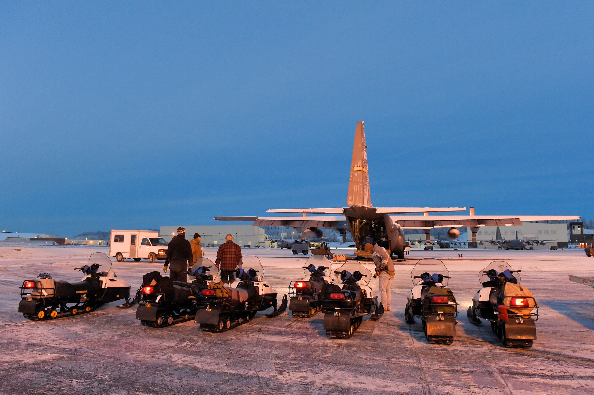 JOINT BASE ELMENDORF-RICHARDSON, Alaska -- U.S. Marines assigned to Delta Company, 4th Law Enforcement Battalion, deliver toys to children living in remote villages of Alaska as part of the Toys for Tots program, Dec. 8. After traveling to a remote hub of villages via aircraft provided by the 144th Airlift Squadron, Alaska Air National Guard, the Marines travel to different villages on snow machines. This year three teams of Marines traveled to numerous villages in the vicinities of Kotzebue, Galena and McGrath. Toys for Tots is a program run by the United States Marine Corps Reserve with a goal of delivering, through a new toy at Christmas, a message of hope to less fortunate youngsters that will assist them in becoming responsible, productive and patriotic citizens. (U.S. Air Force photo/Alejandro Peña)  